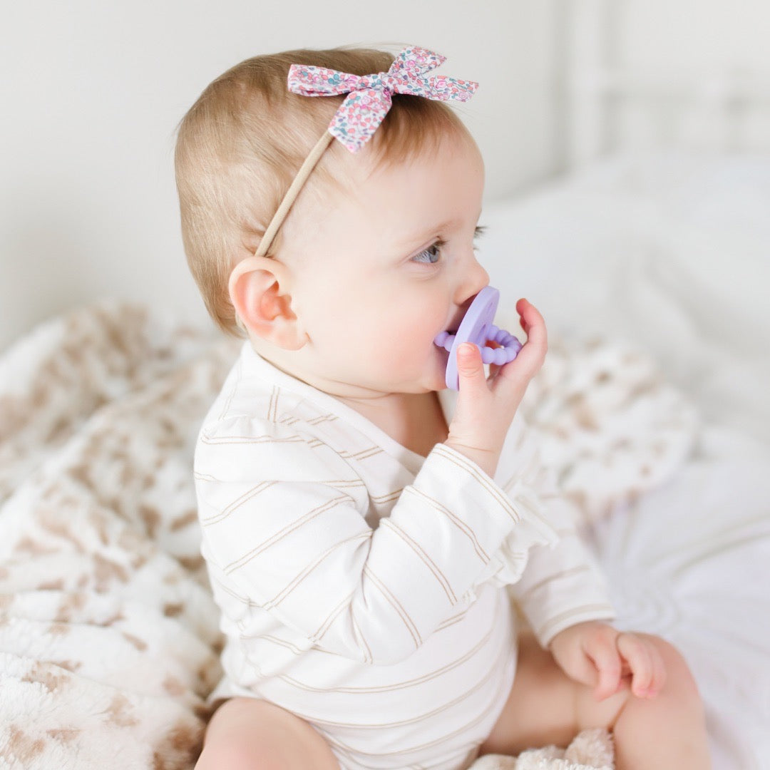 Baby teething on the Lavender Cutie Bit.