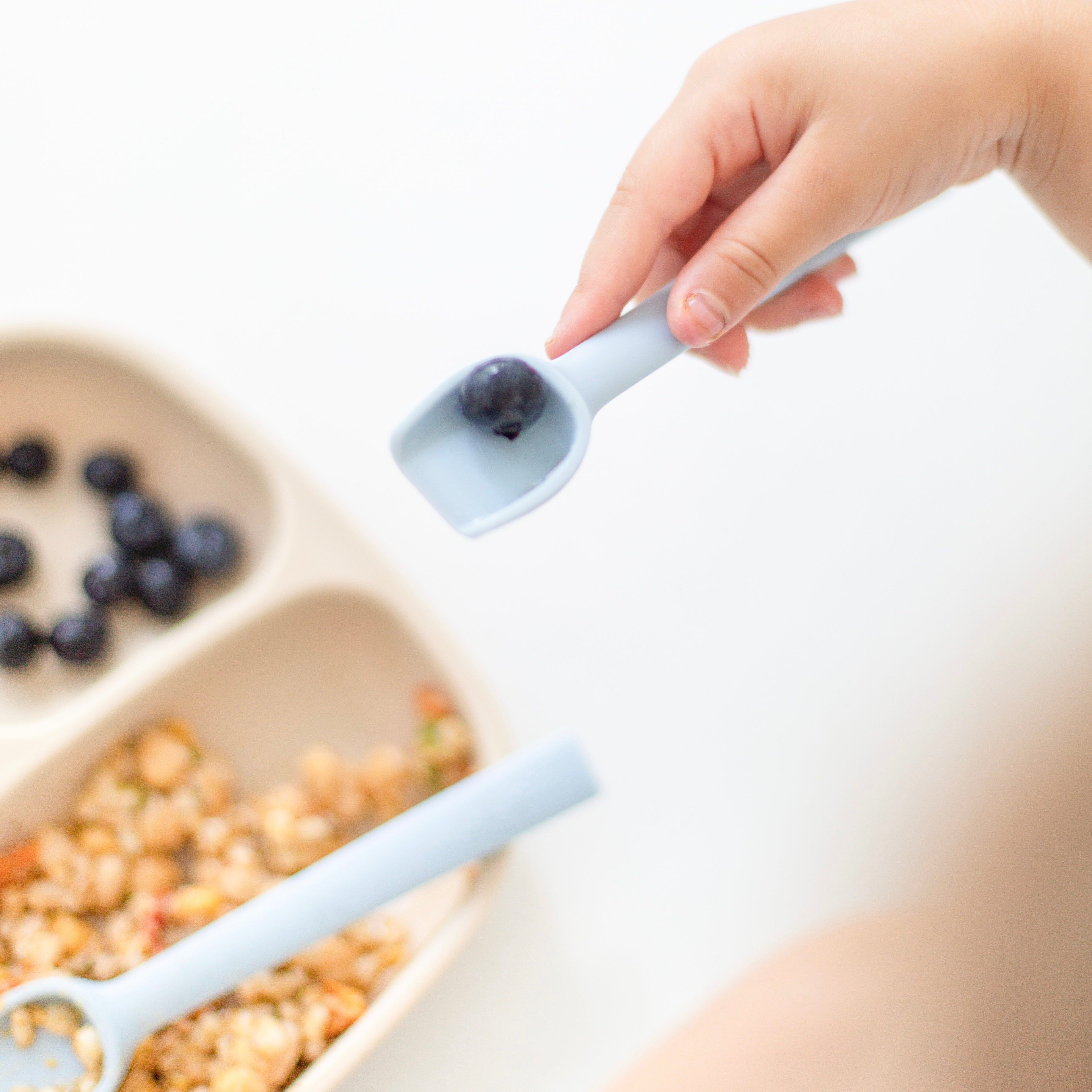 Cutie Spoovel with a blueberry on it.