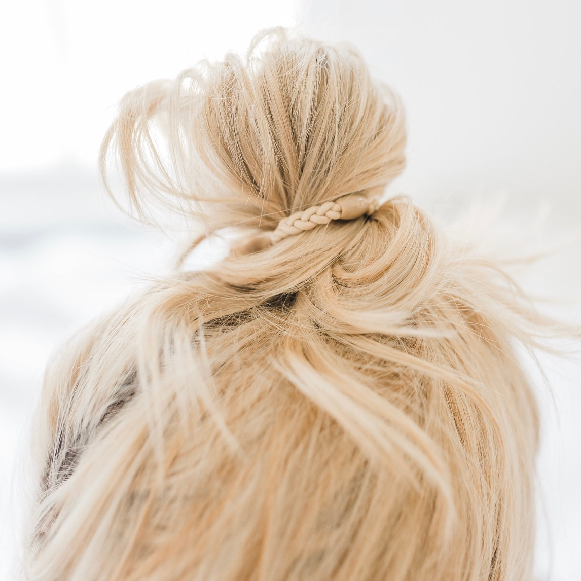 Woman wearing a Cutie Band in her hair.