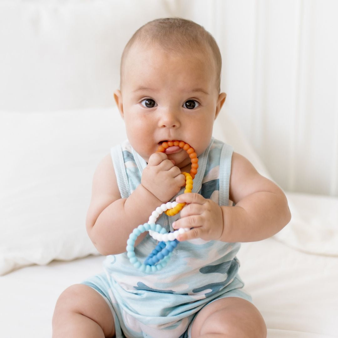 Baby boy using the Paddleboard Cutie Clinks.