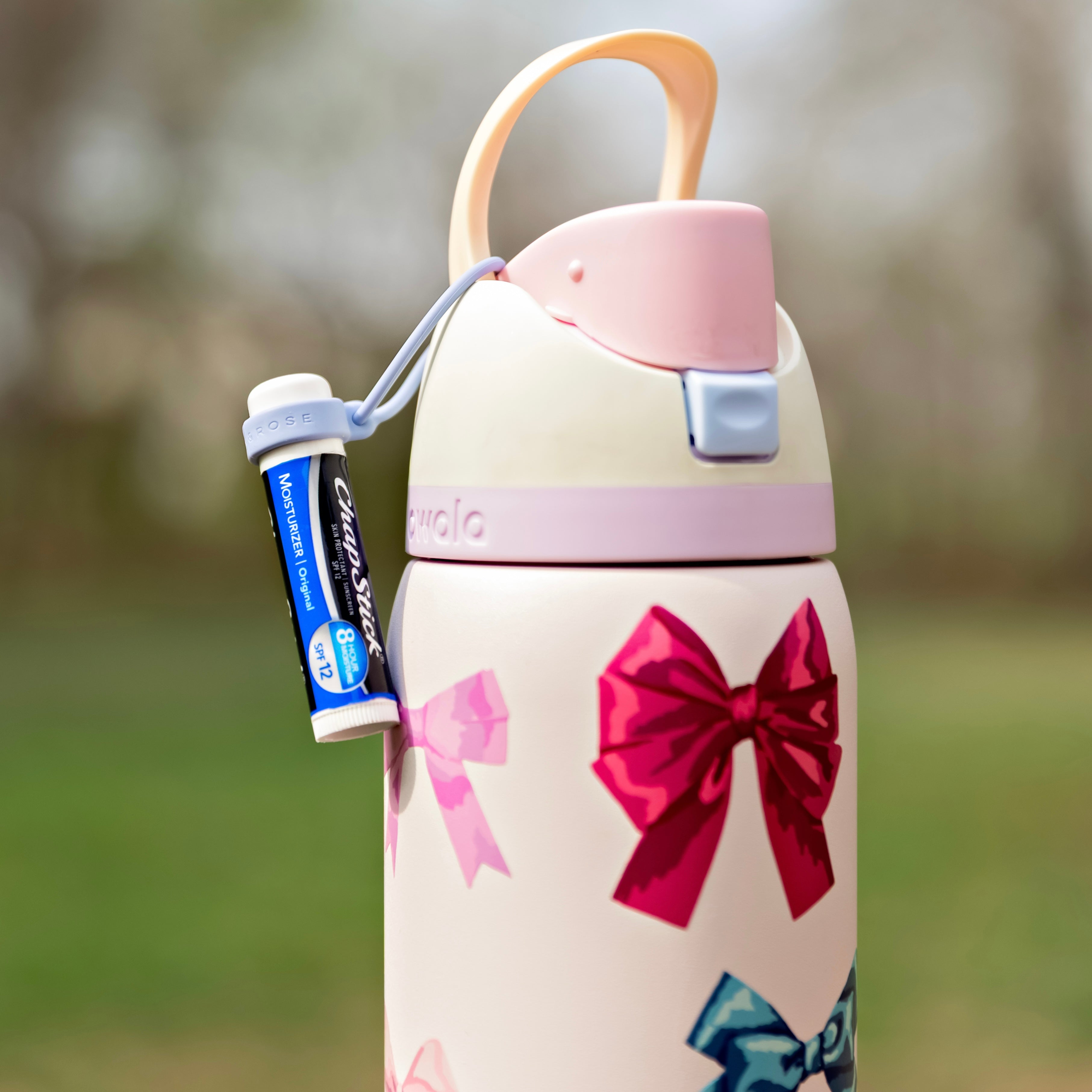 Lip balm holder on water bottle