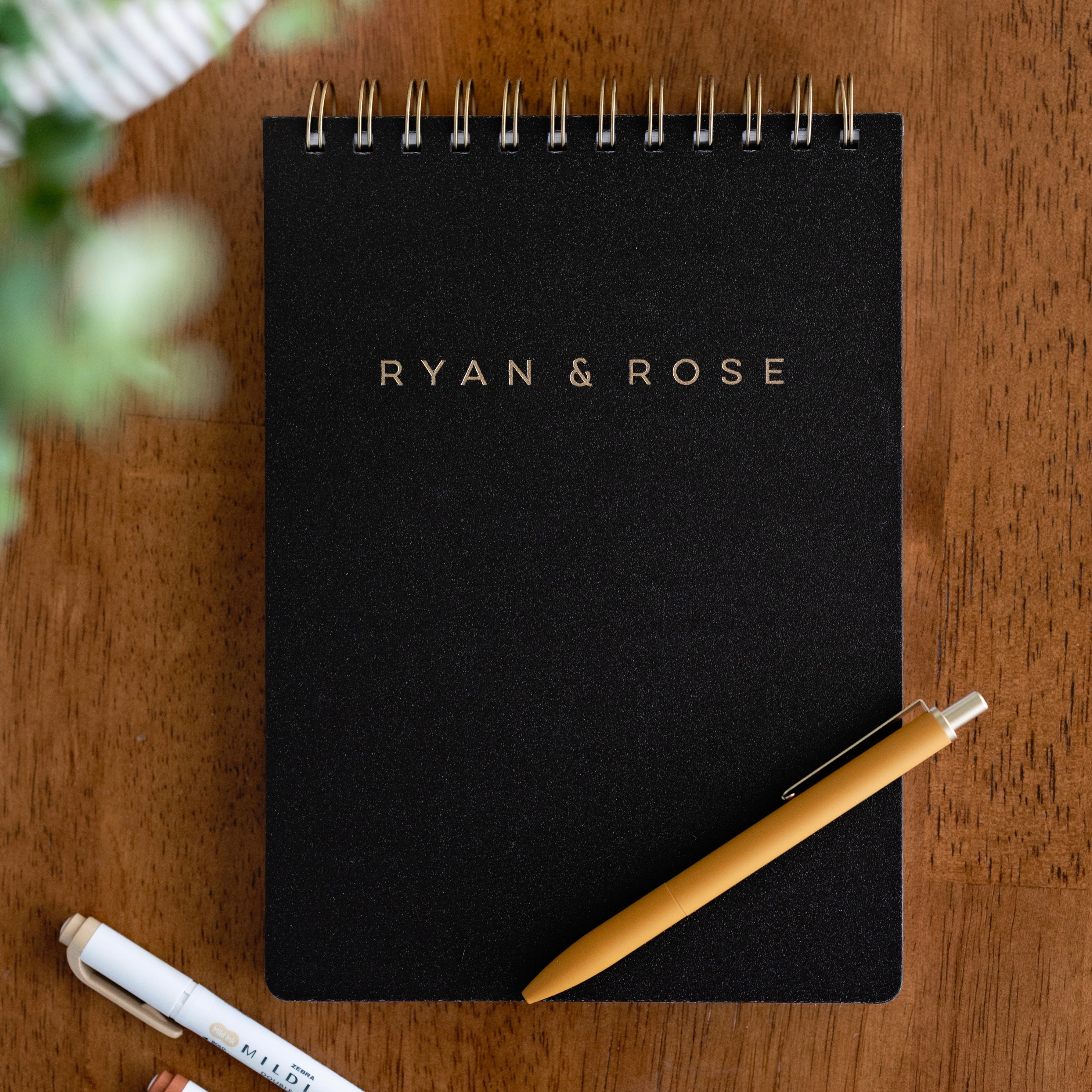 Black notebook with &