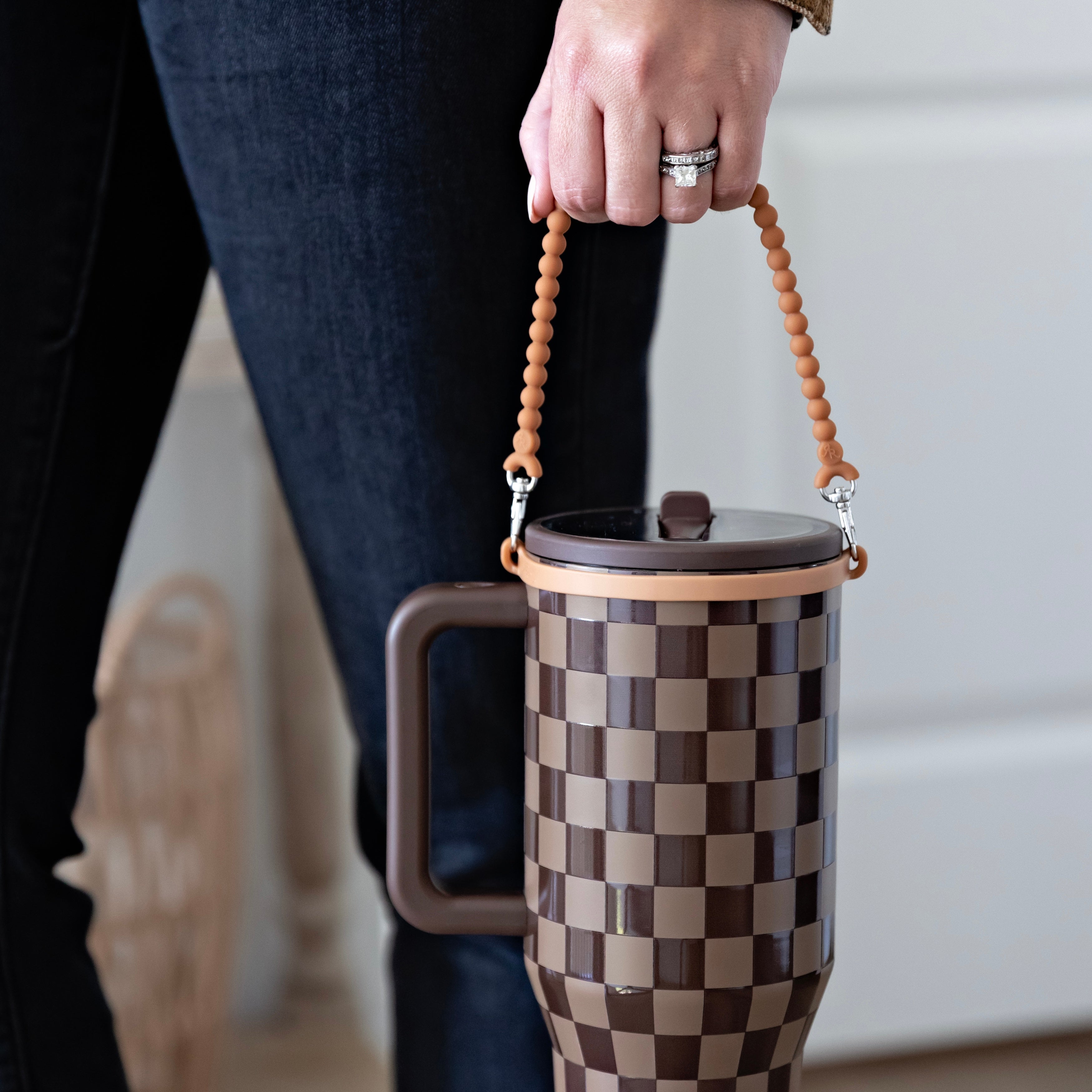 Woman holding handle on water bottle