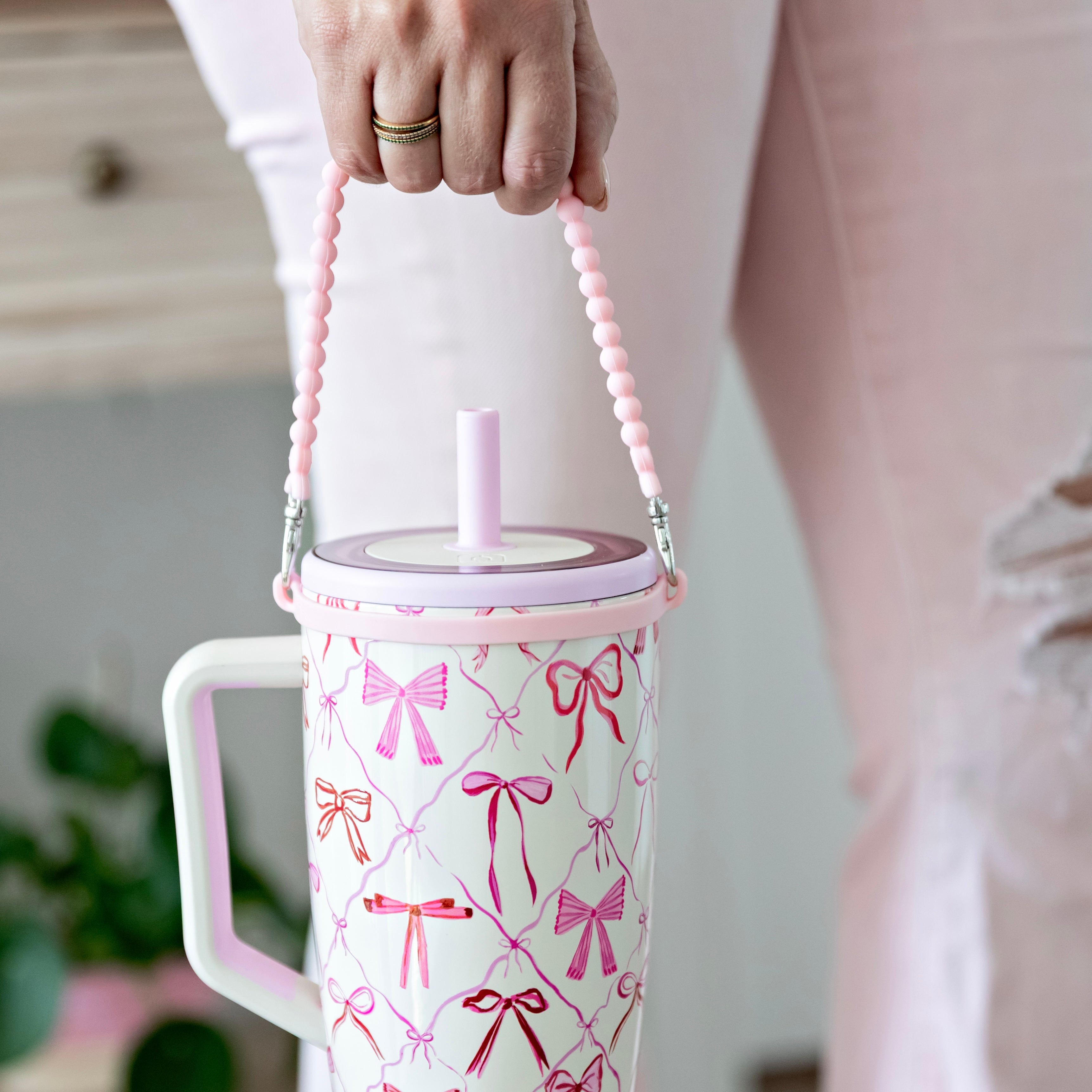 Woman holding handle on water bottle