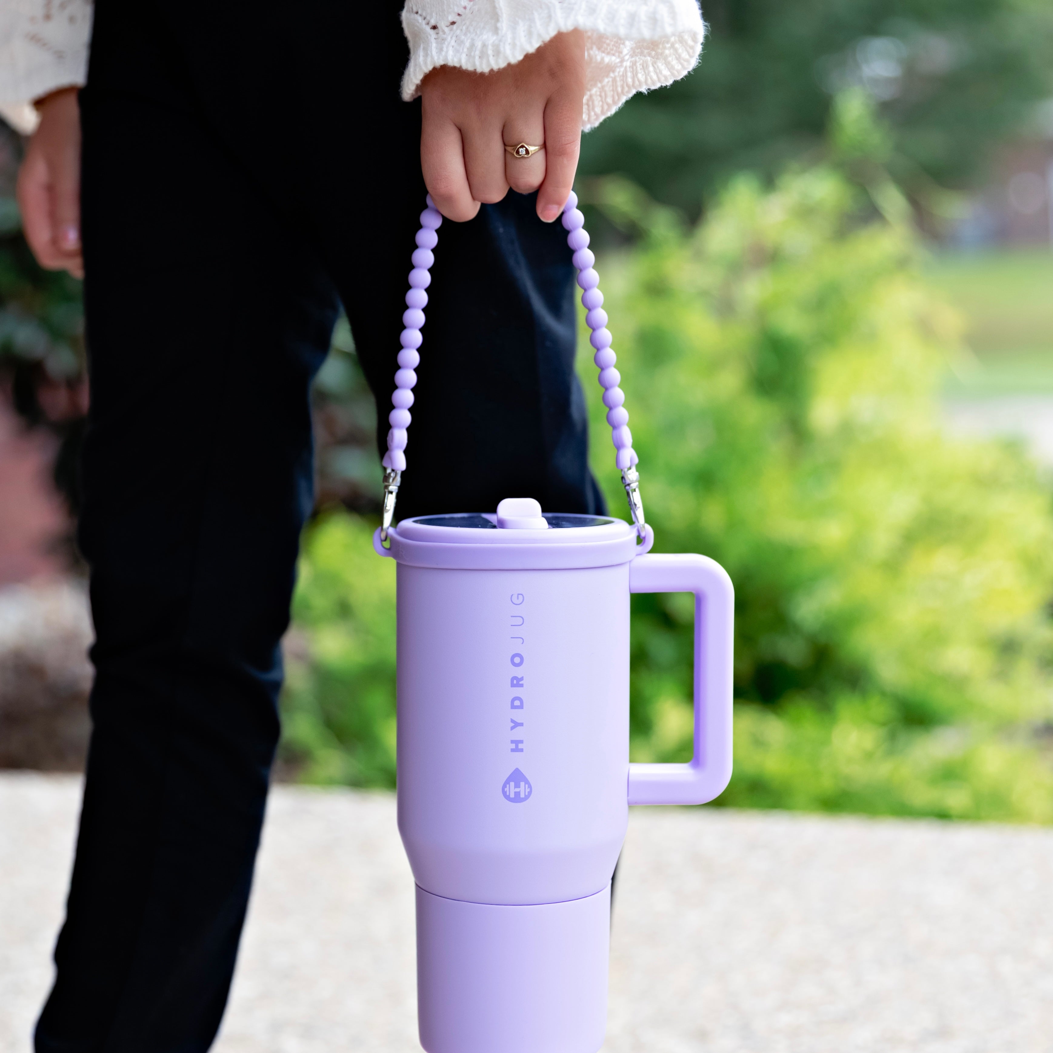 Girl holding handle on water bottle