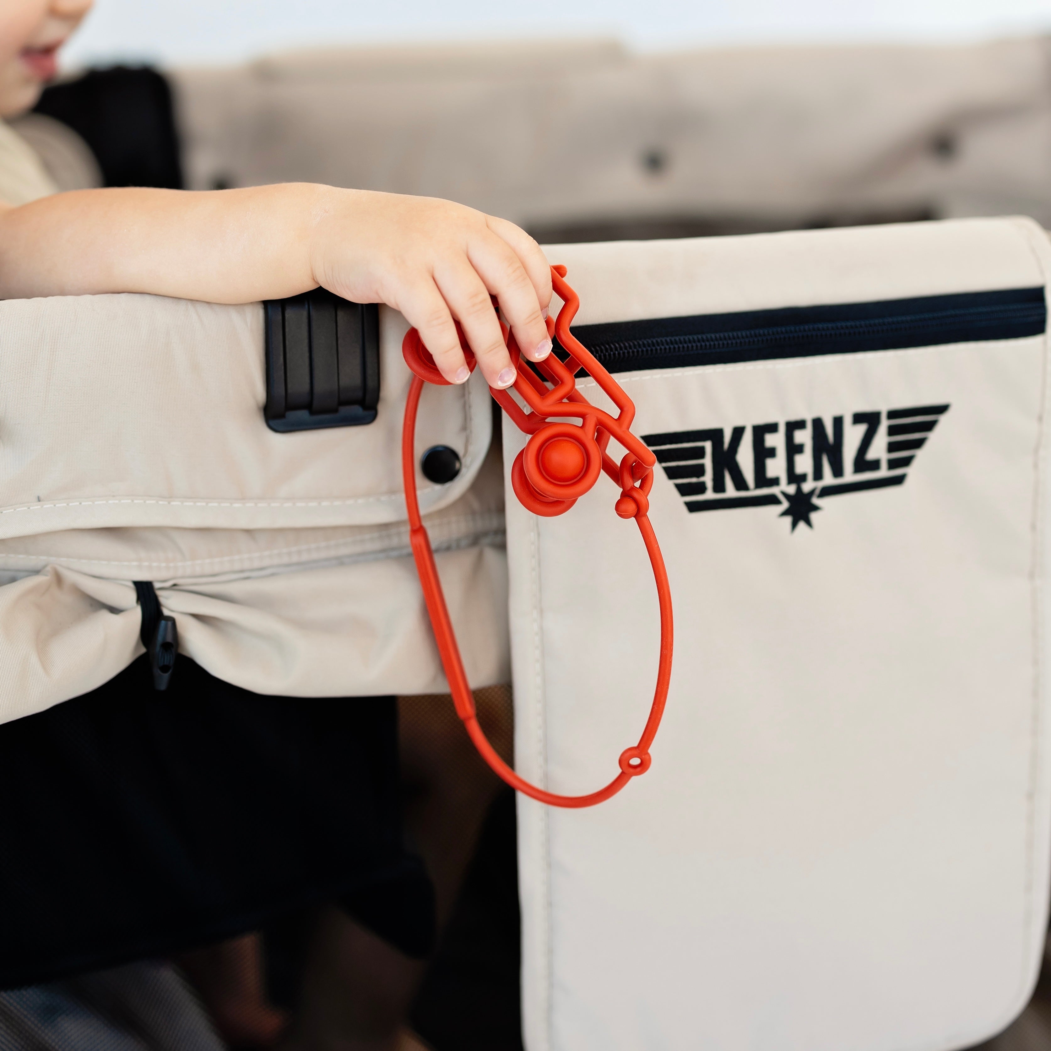 Banshee teether attached to wagon stroller