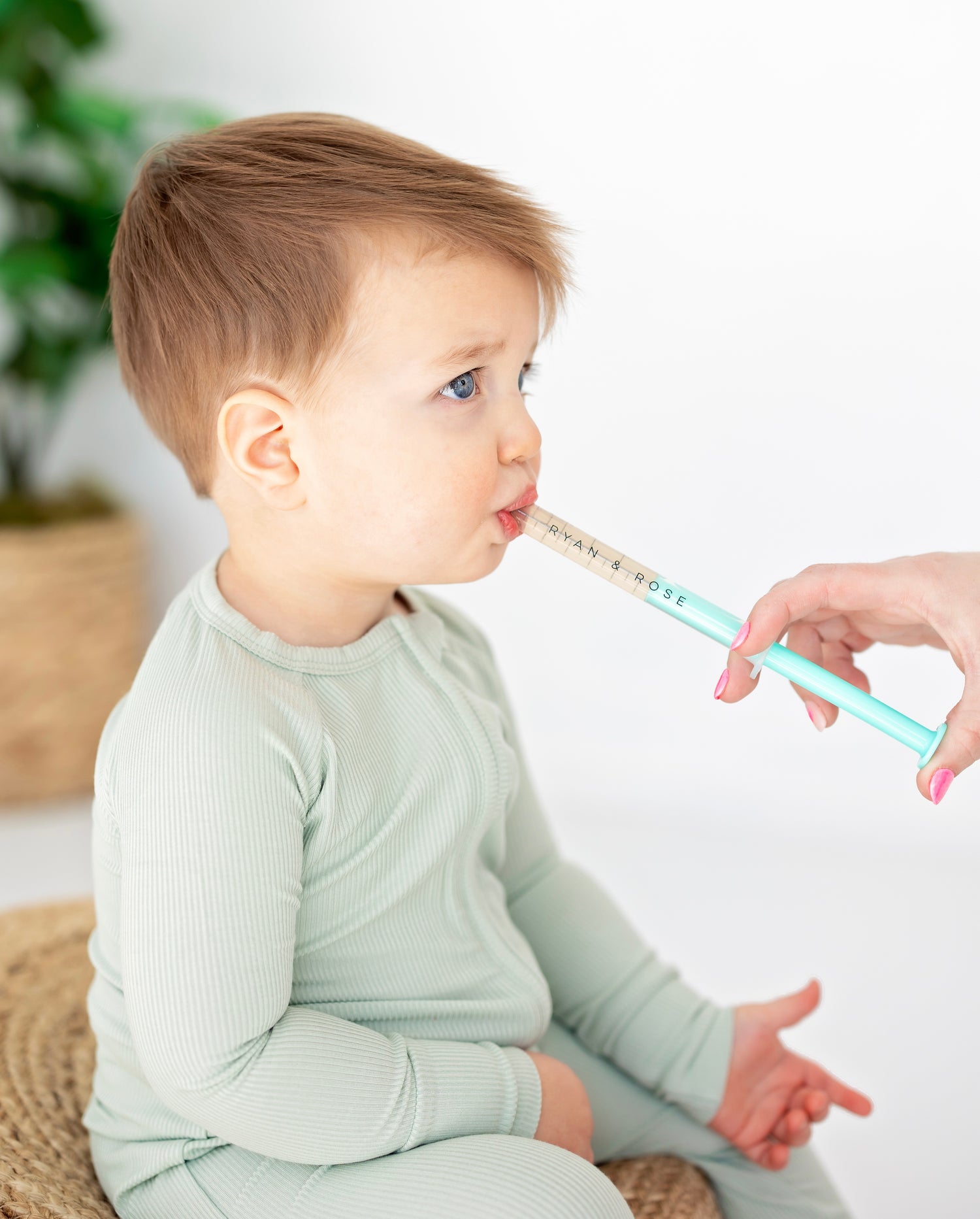 Child getting medicine with the cutie dose