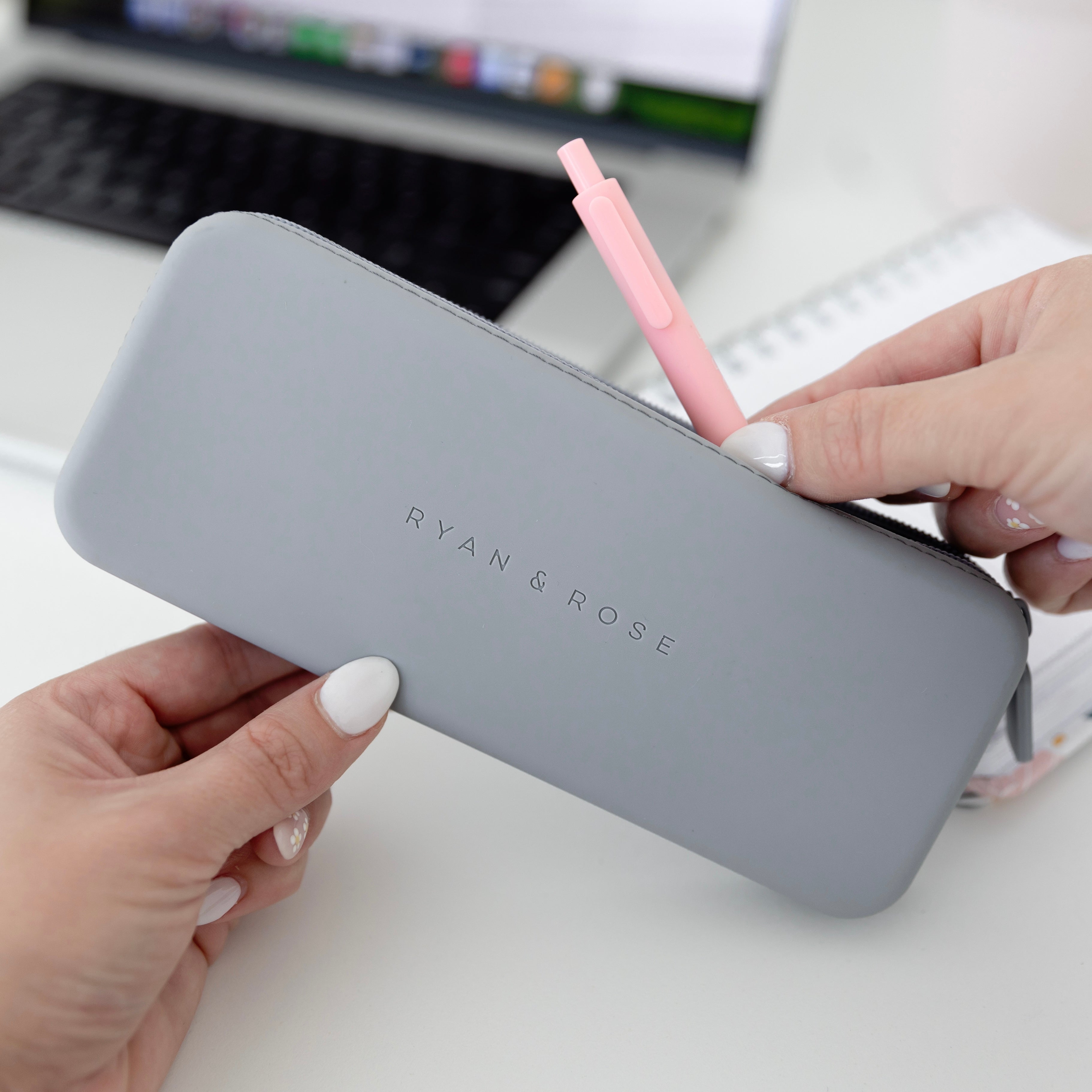 Woman putting a pen in pouch