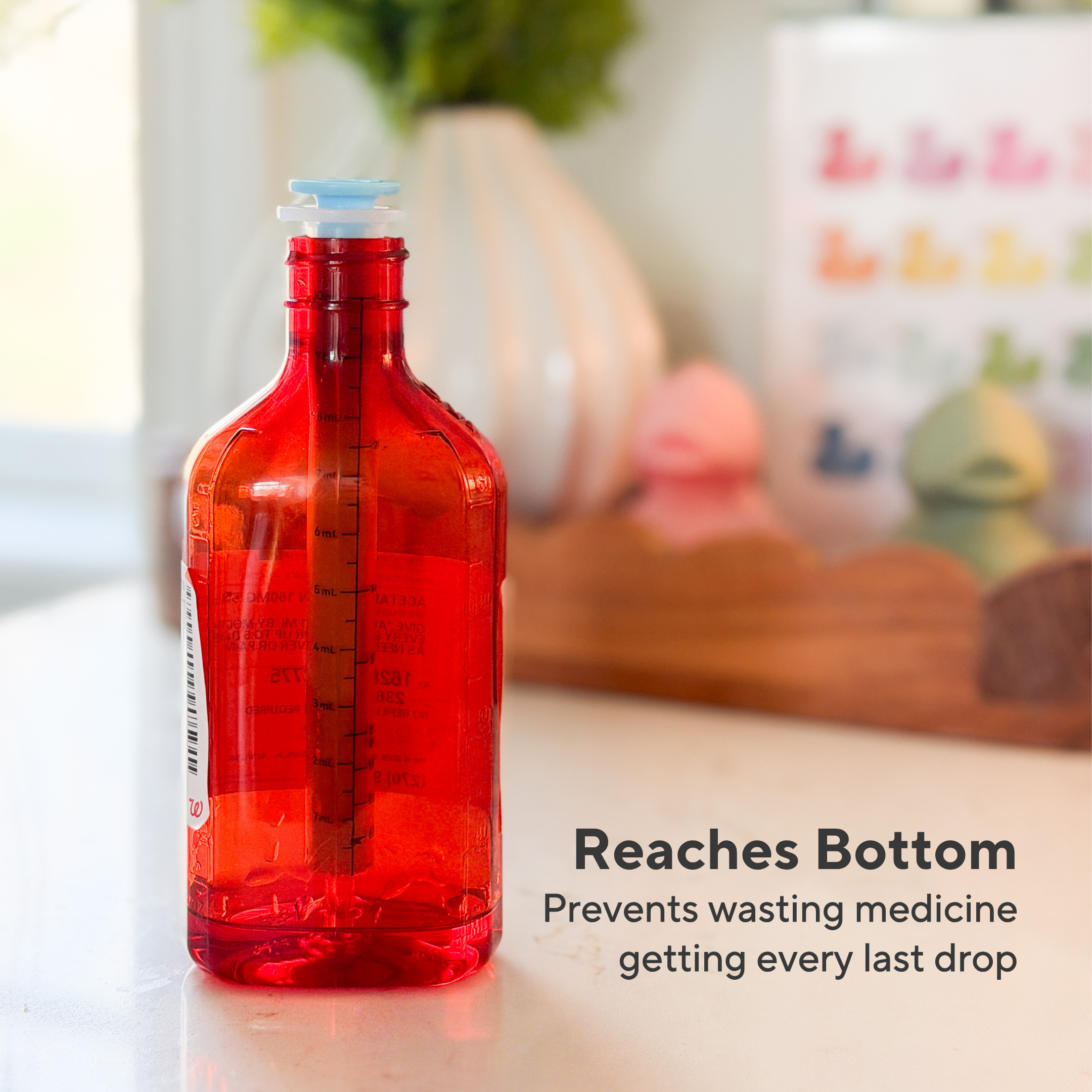 Red bottle with a blue cap on a blurred background