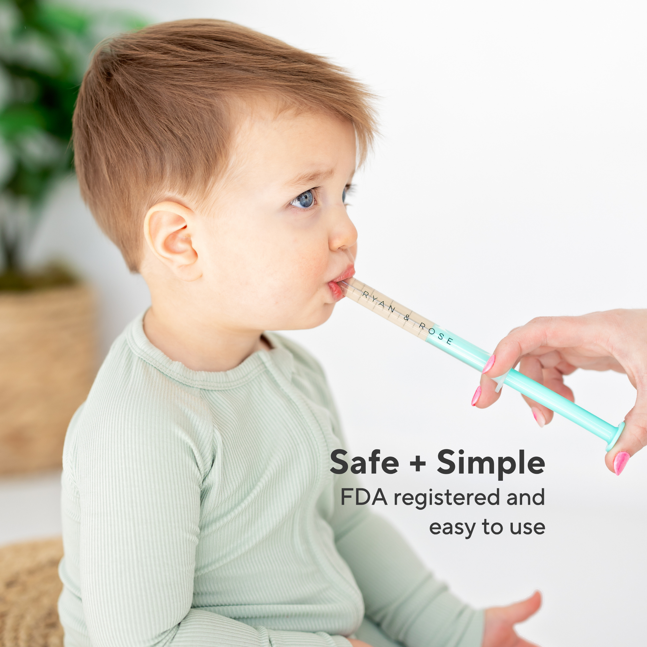 Child using a straw with text &