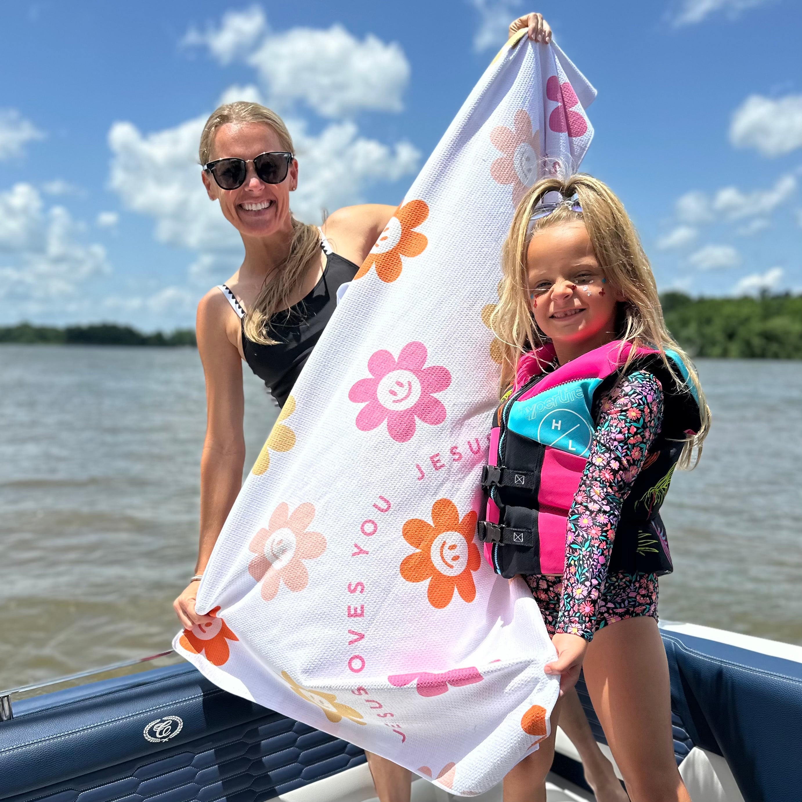 Woman and kid holding towel
