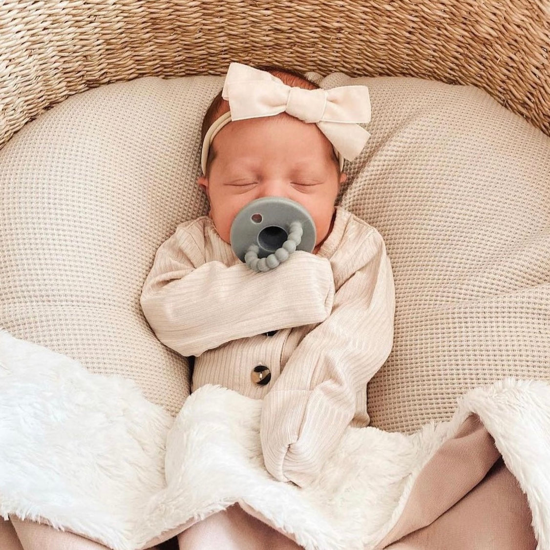 Baby girl in bassinet