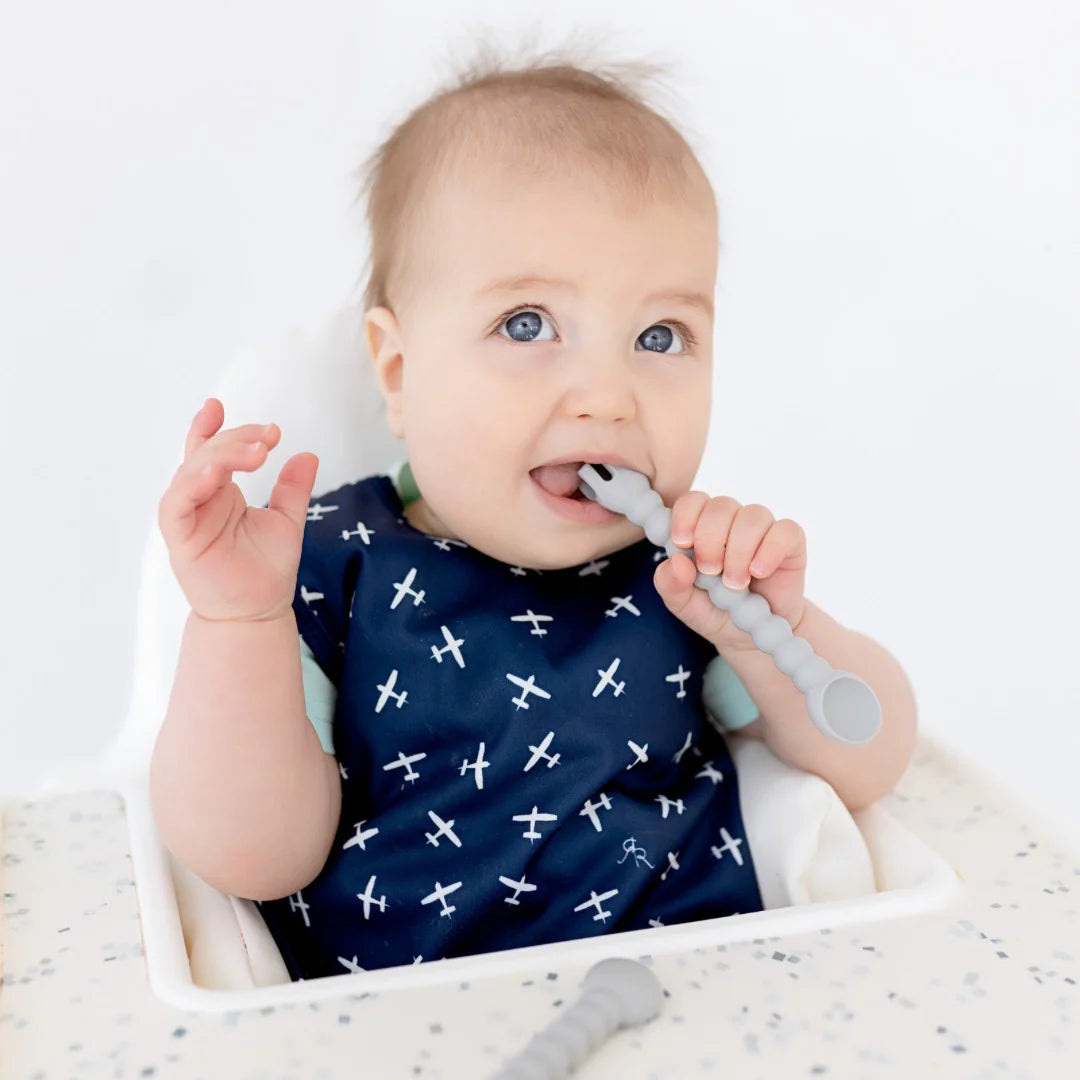 Baby eating in high chair