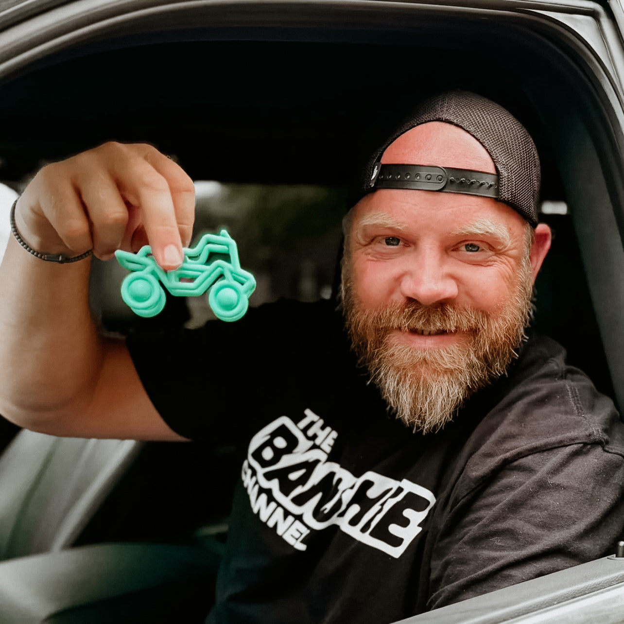 Man holding banshee teether