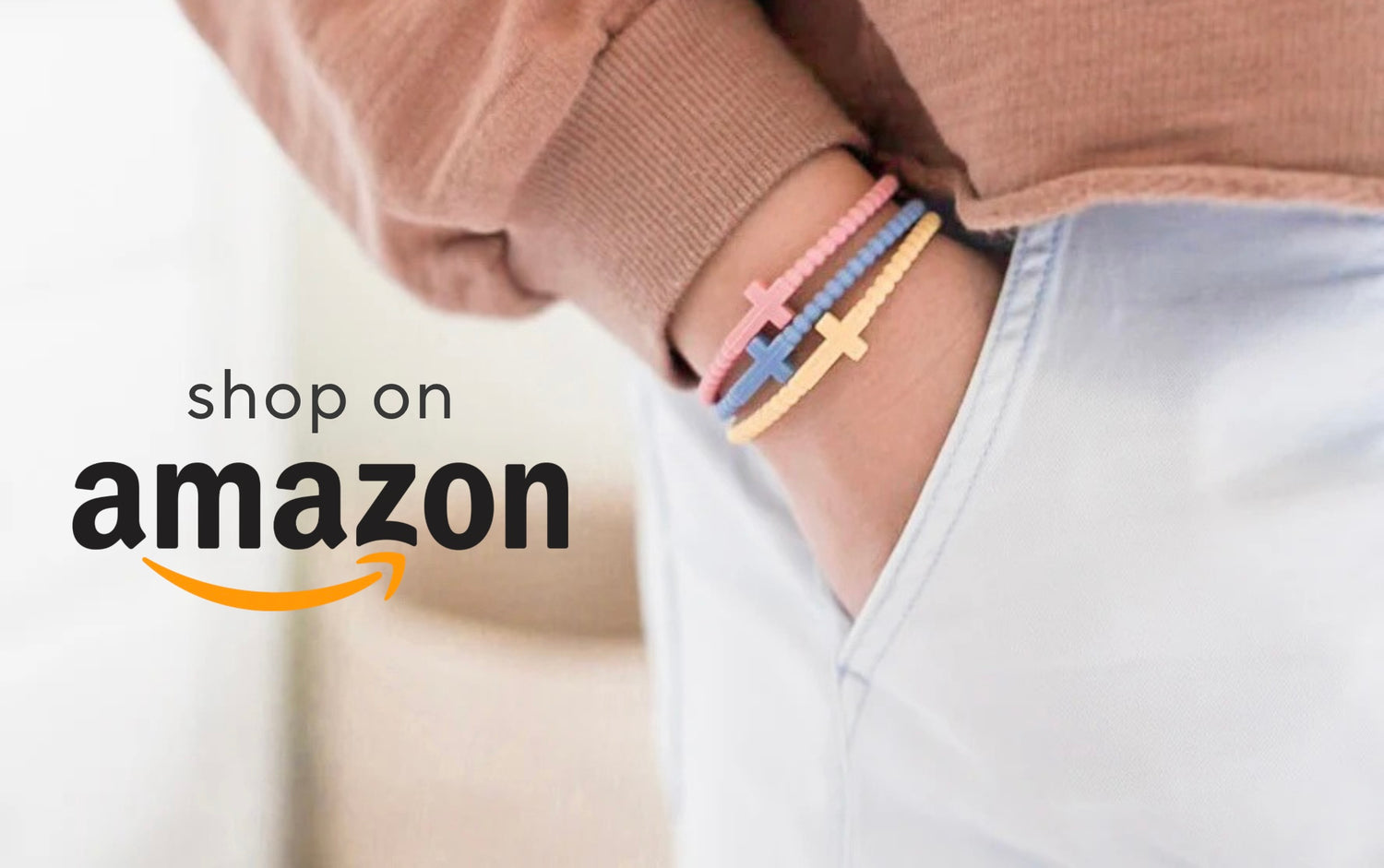 Person wearing colorful bracelets with 'Shop on Amazon' text overlay