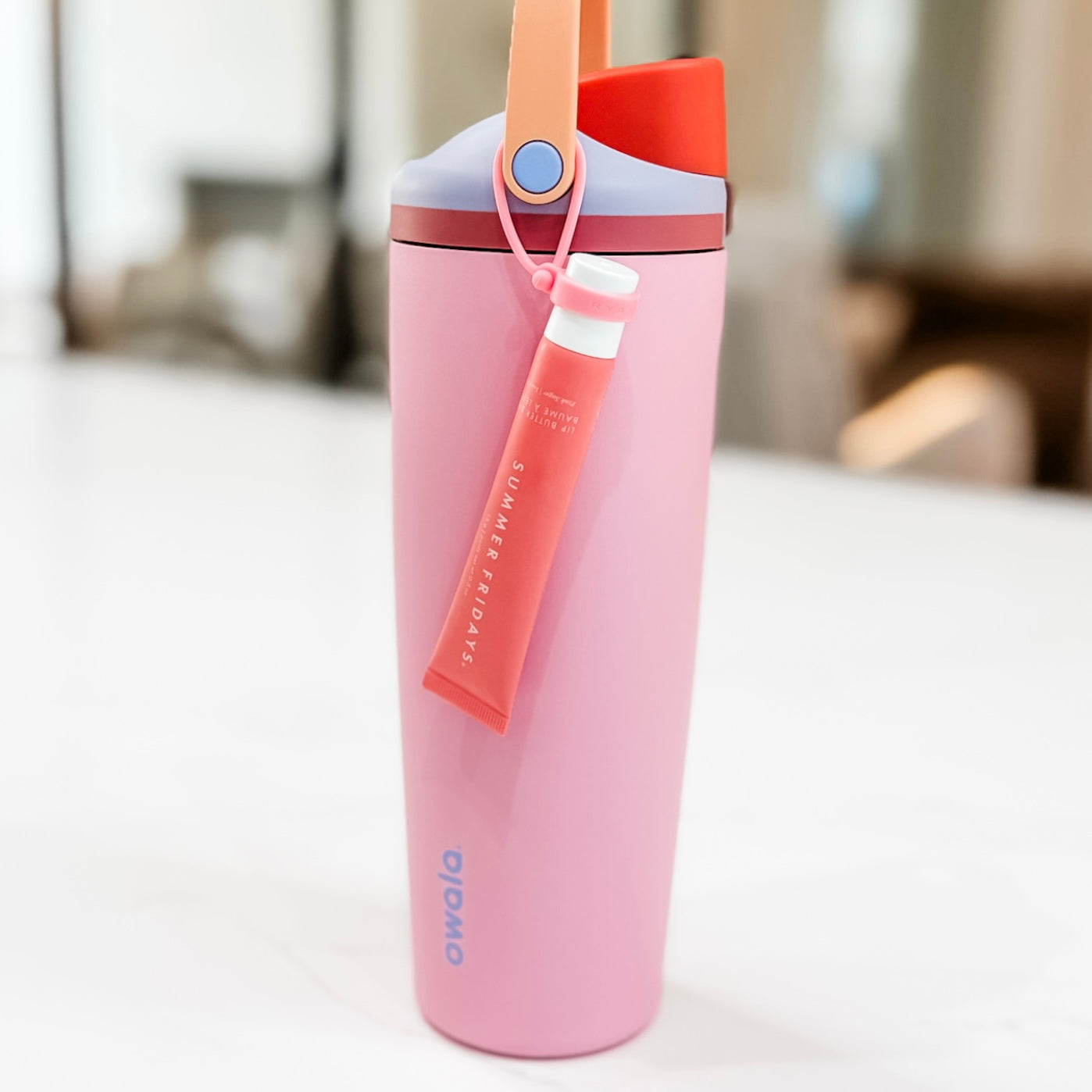 Lip balm holder on water bottle