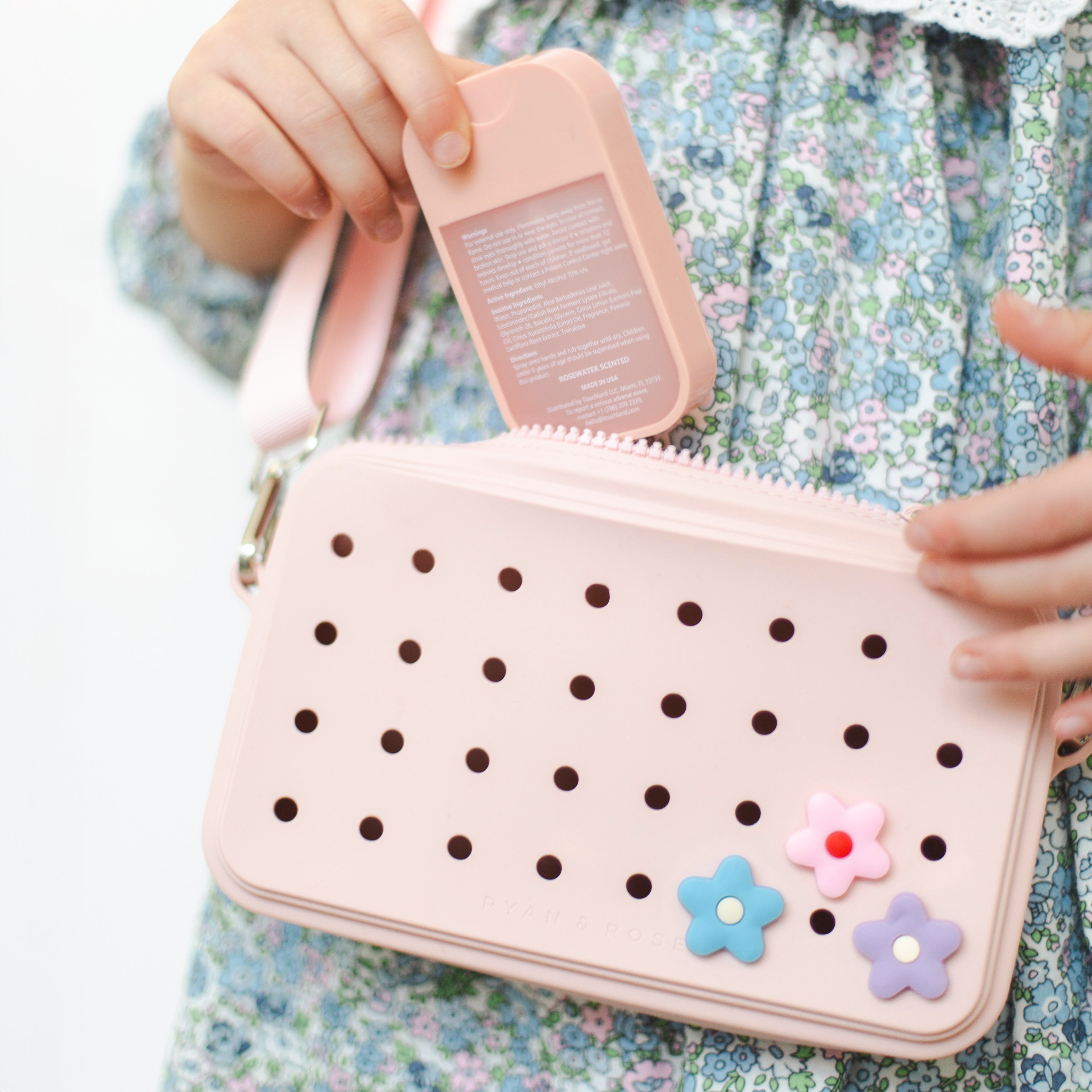Girl wearing crossbody charm purse