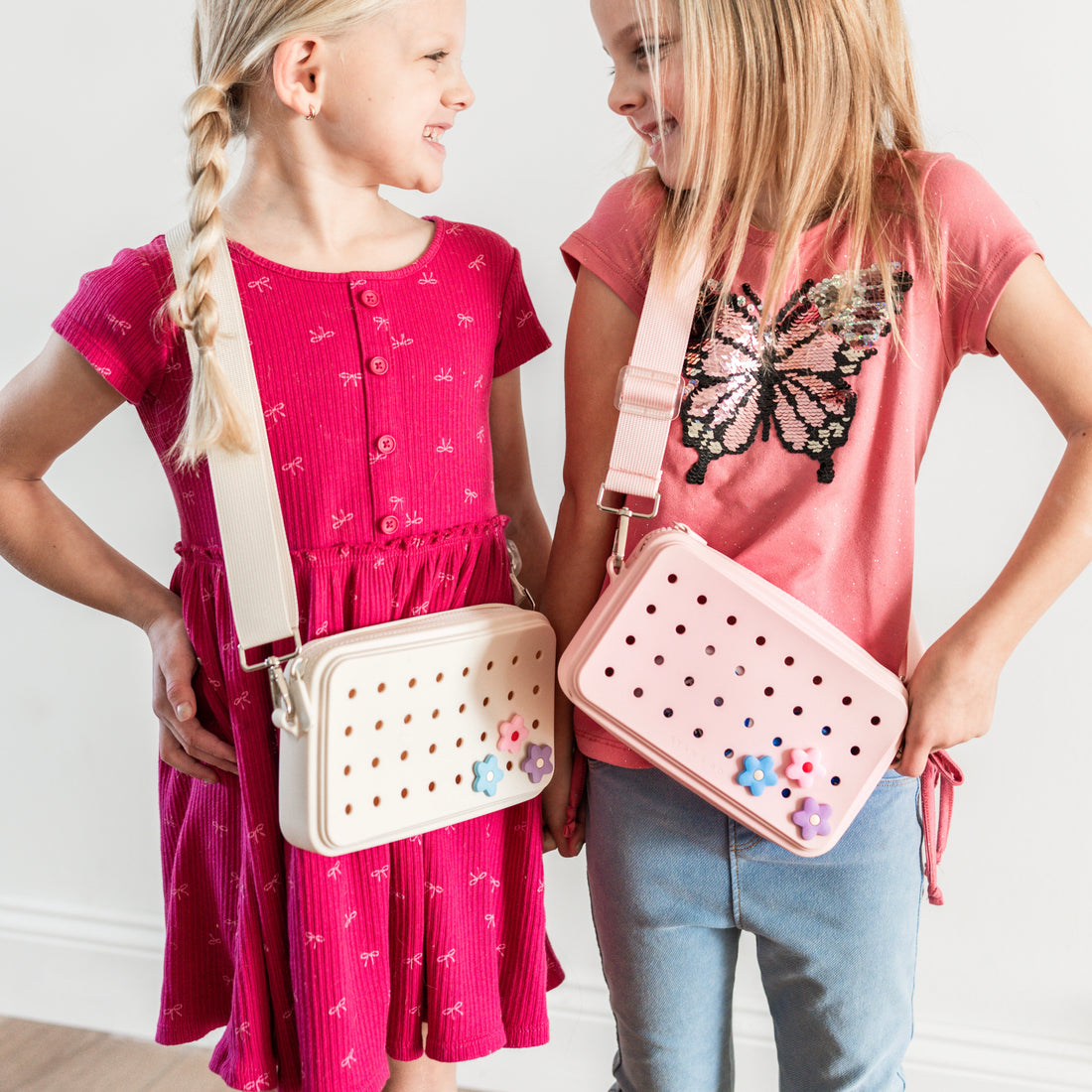 Girls wearing crossbody charm purses