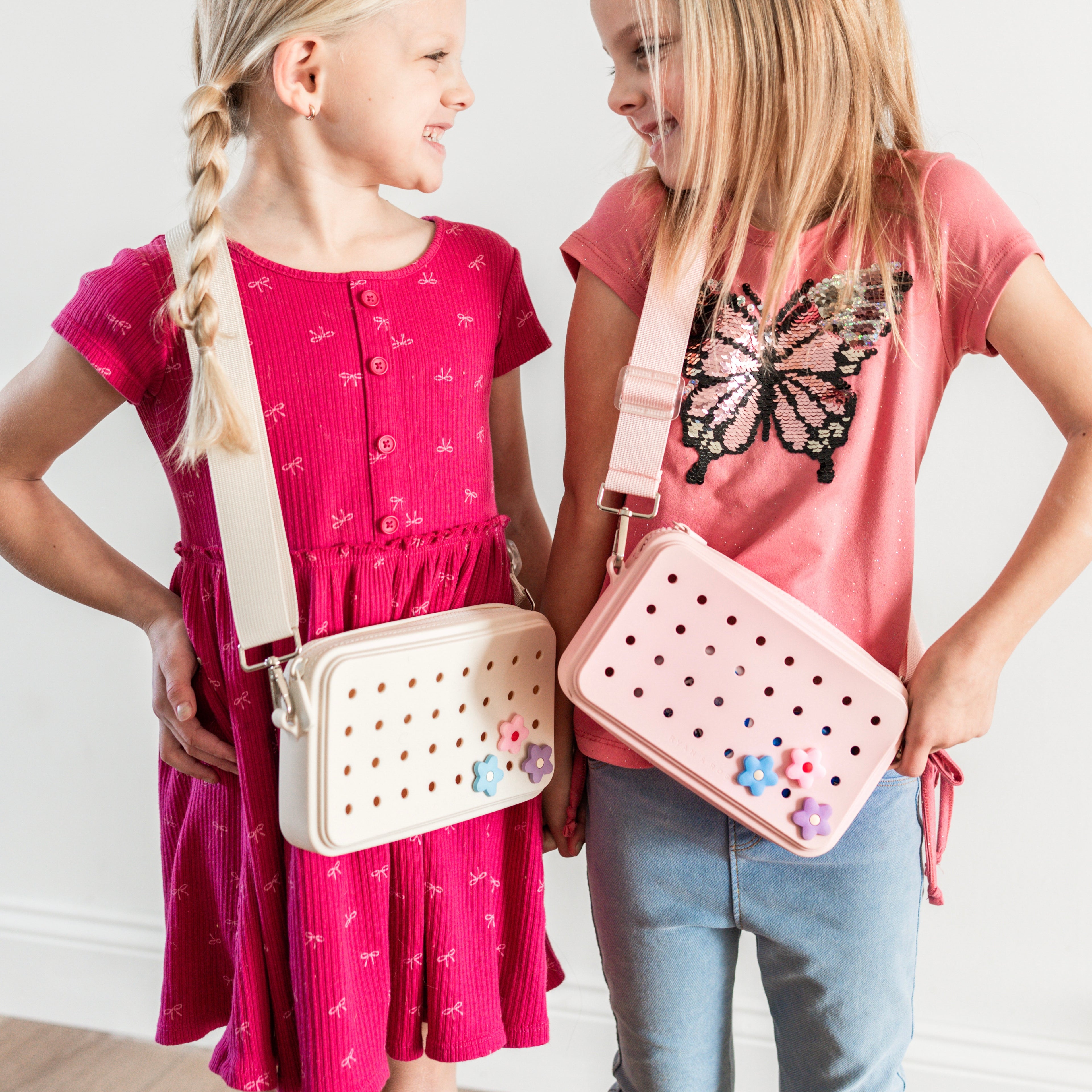 Girls wearing crossbody charm purses