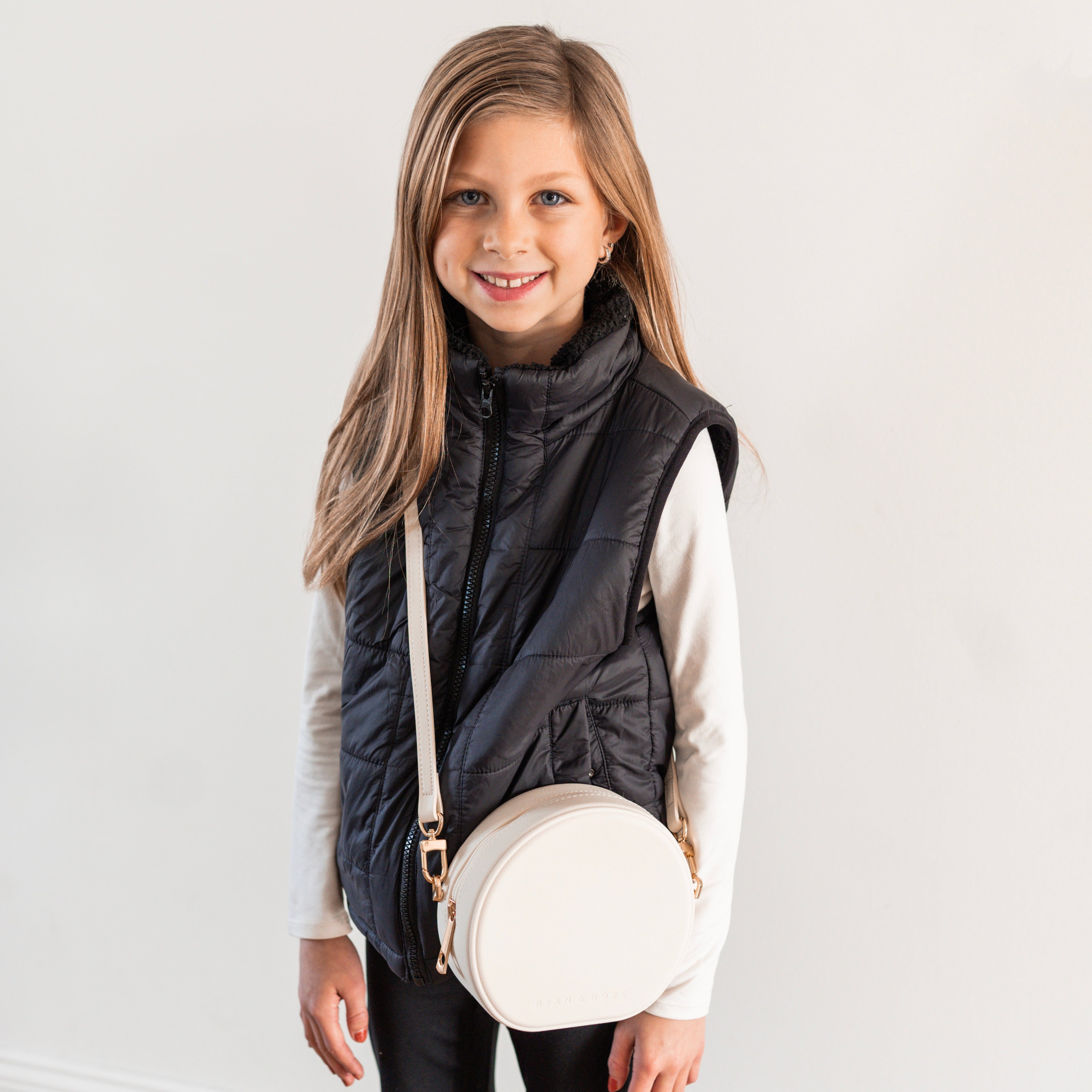 Girl wearing round crossbody purse
