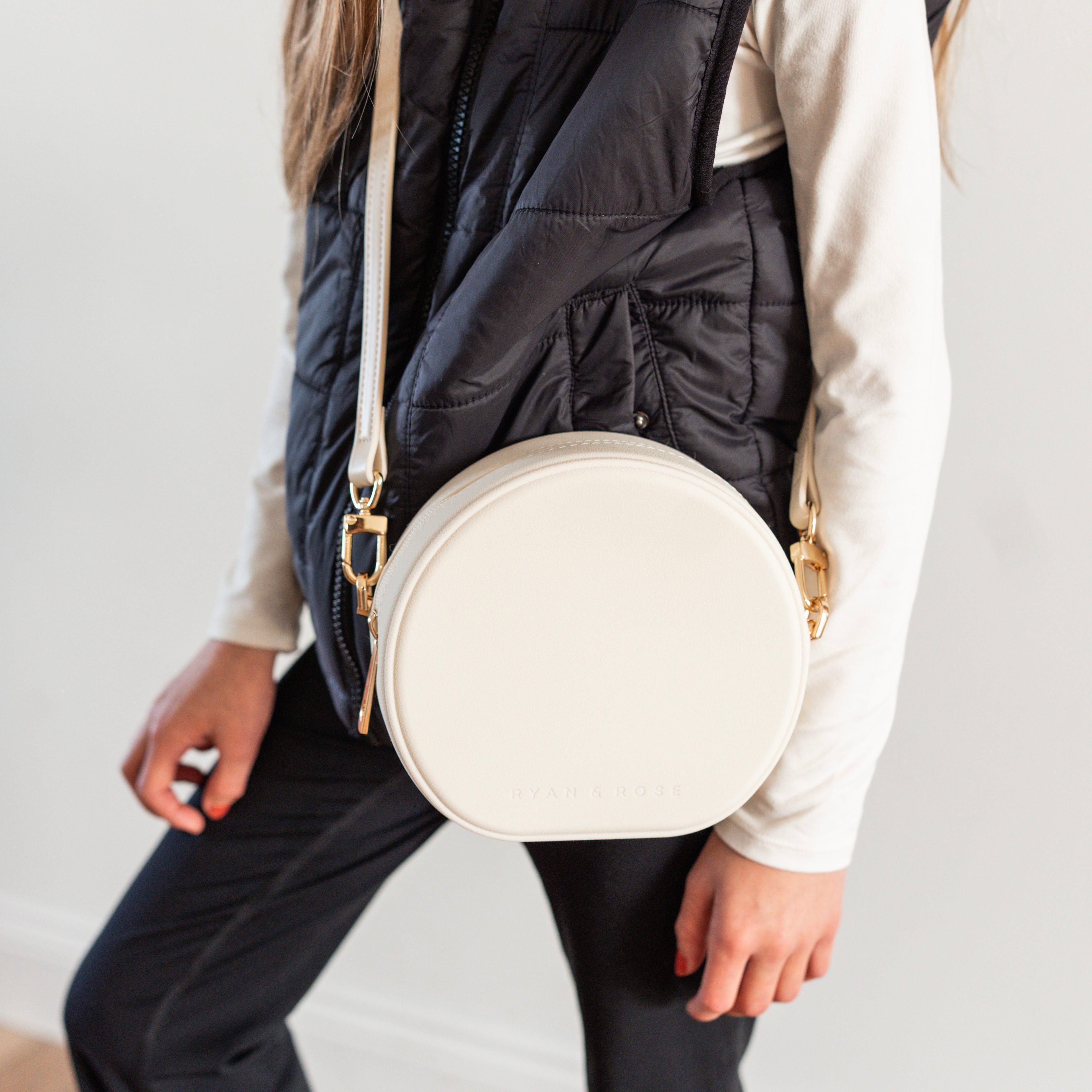 Girl wearing round crossbody purse
