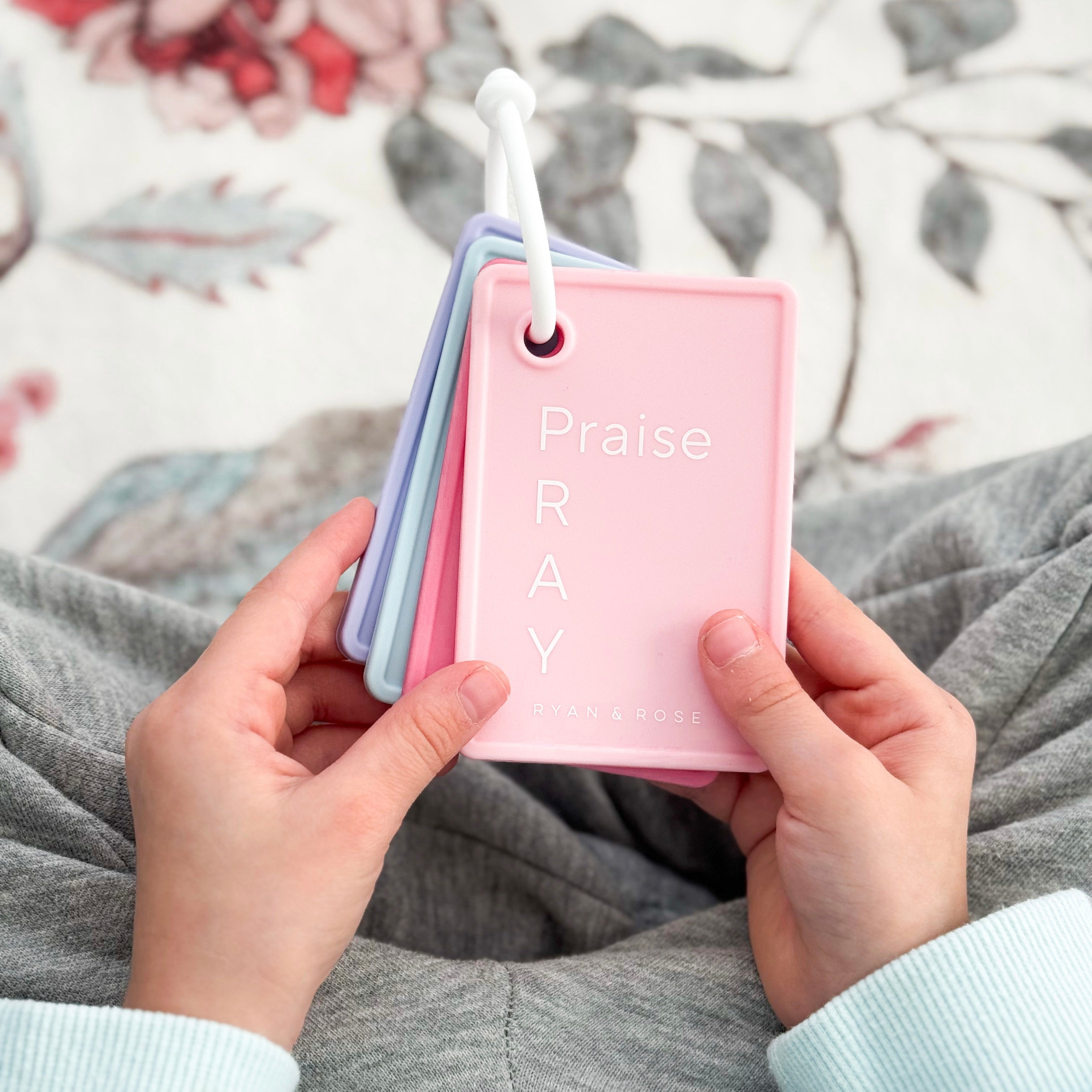 Girl holding prayer cards