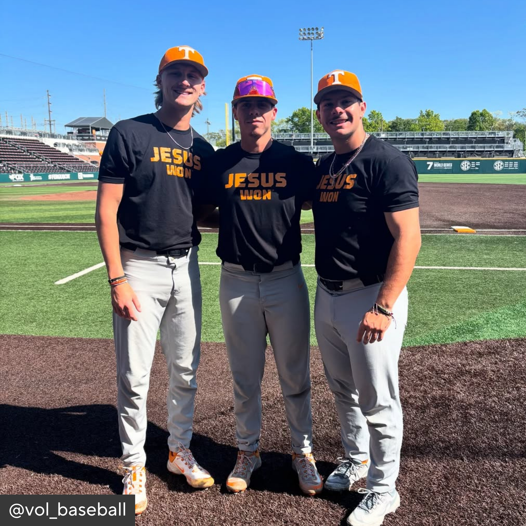 Three baseball players wearing black &