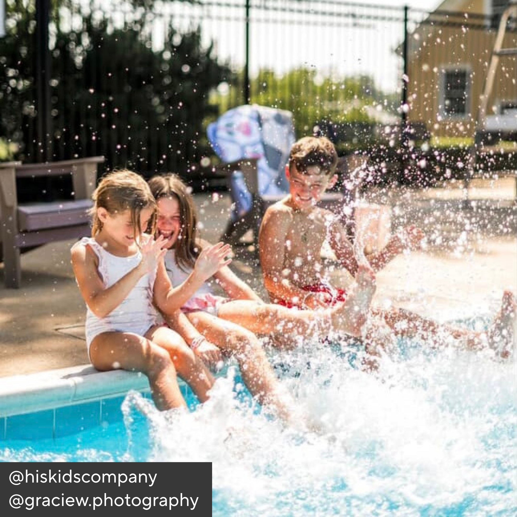 Children playing in a pool with splashes, sitting on the edge.