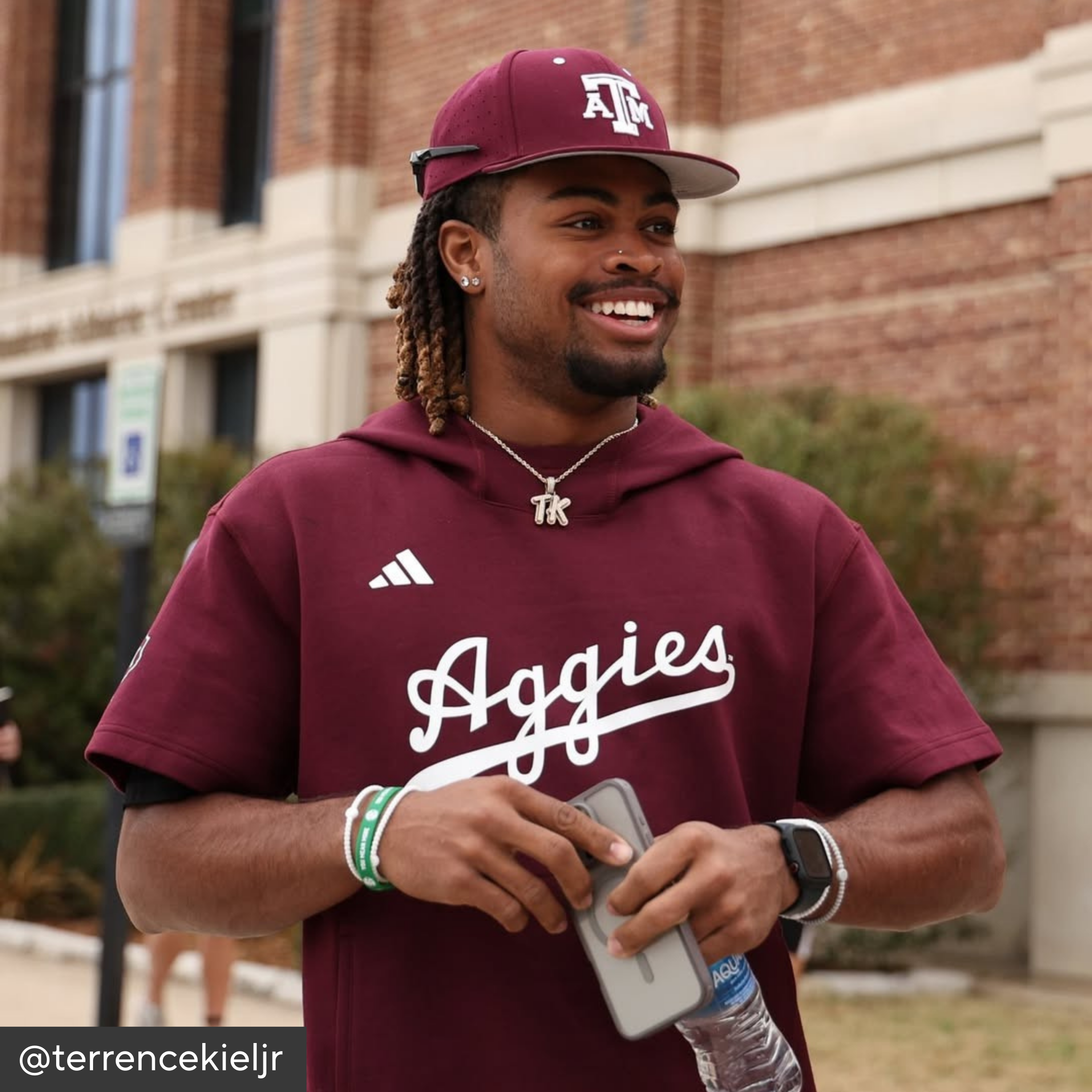 Man wearing a maroon &