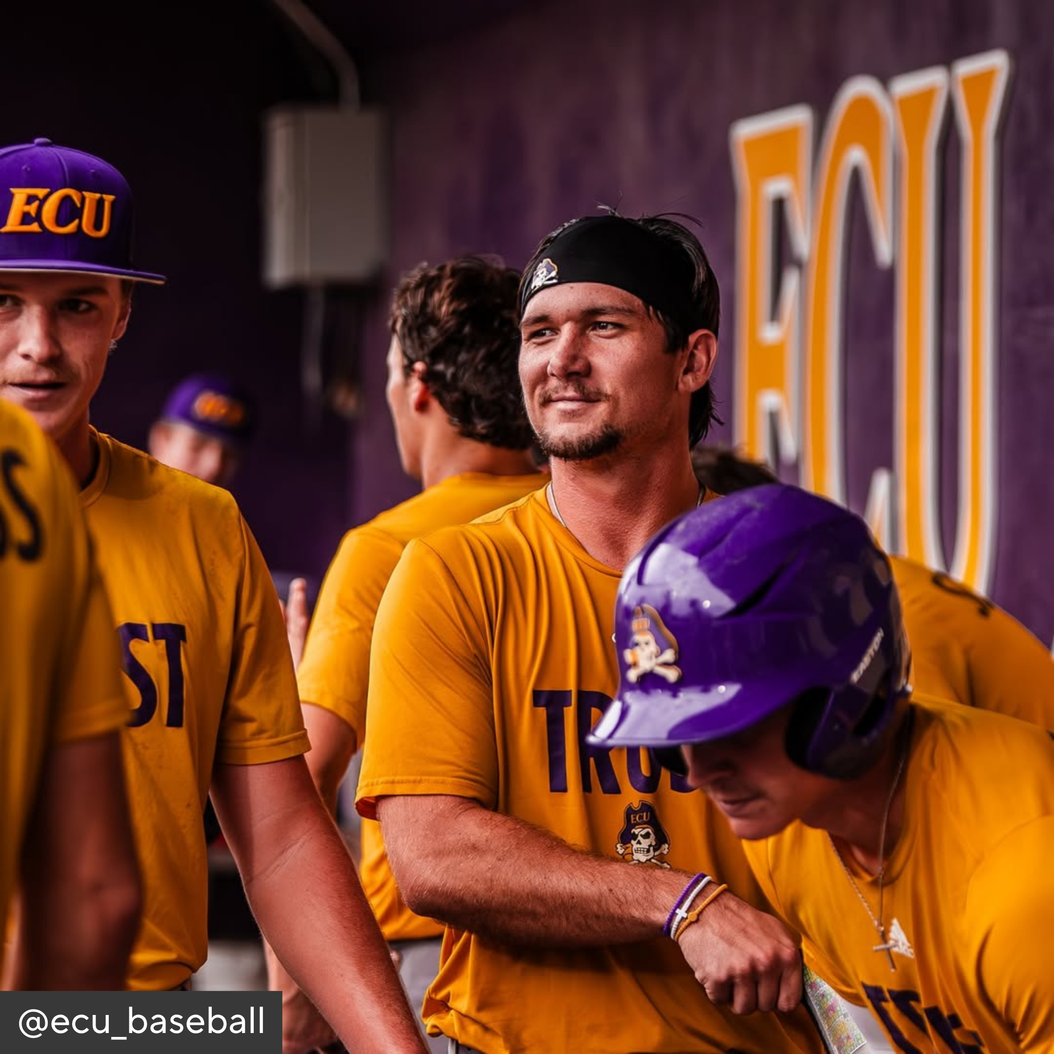Baseball players in yellow jerseys with &