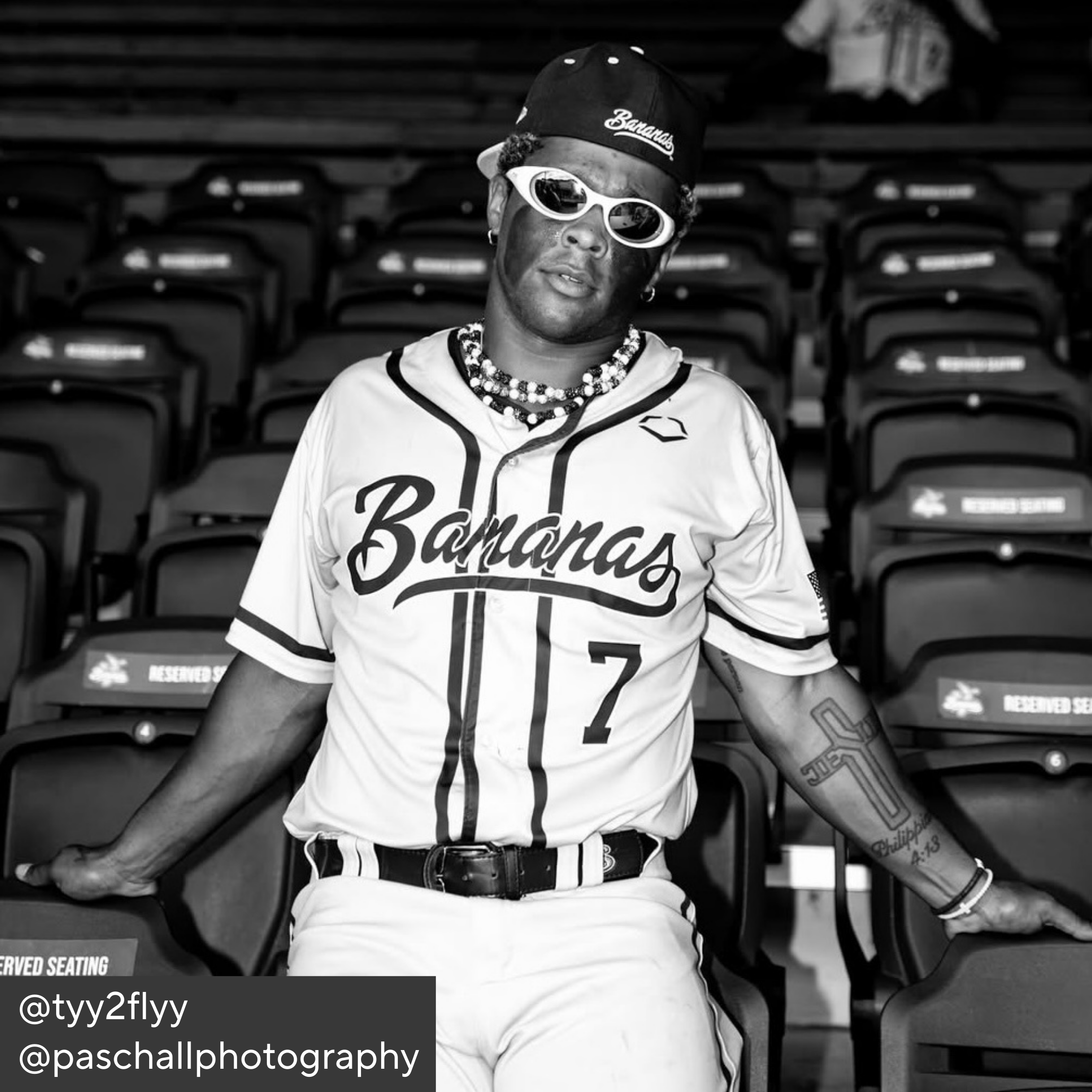 Person wearing a baseball uniform with &