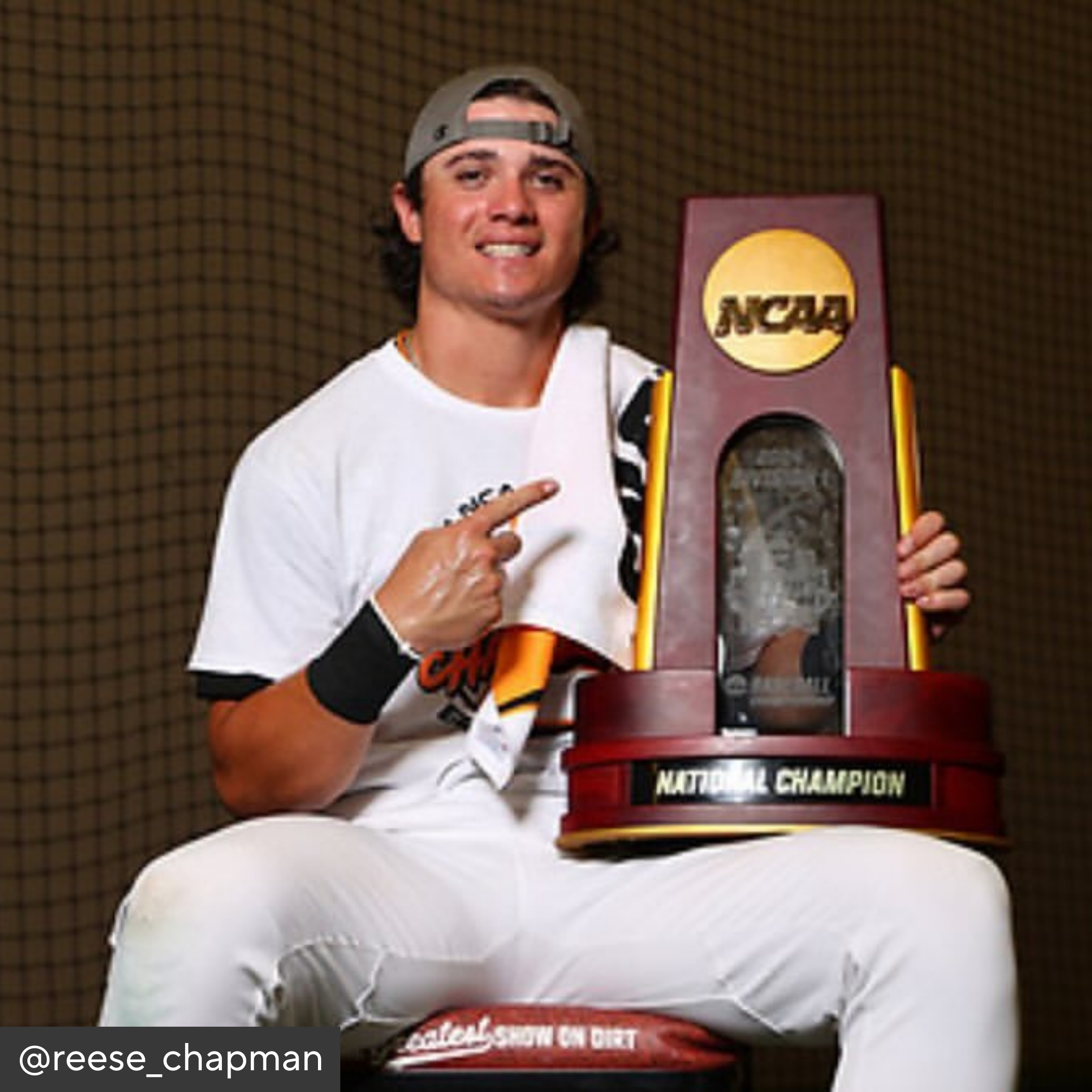 Person holding a NCAA National Champion trophy