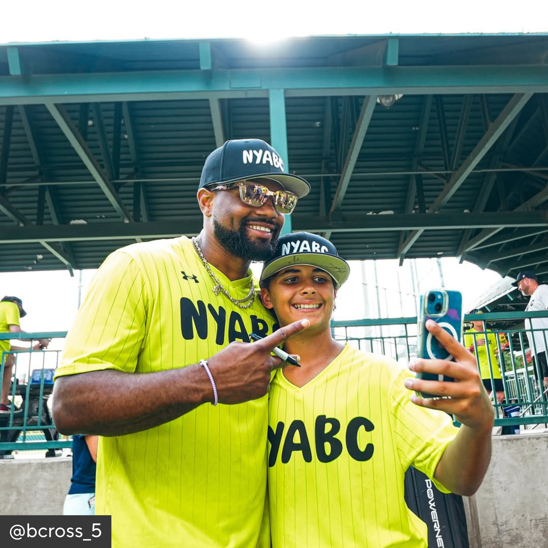 Two people wearing yellow &