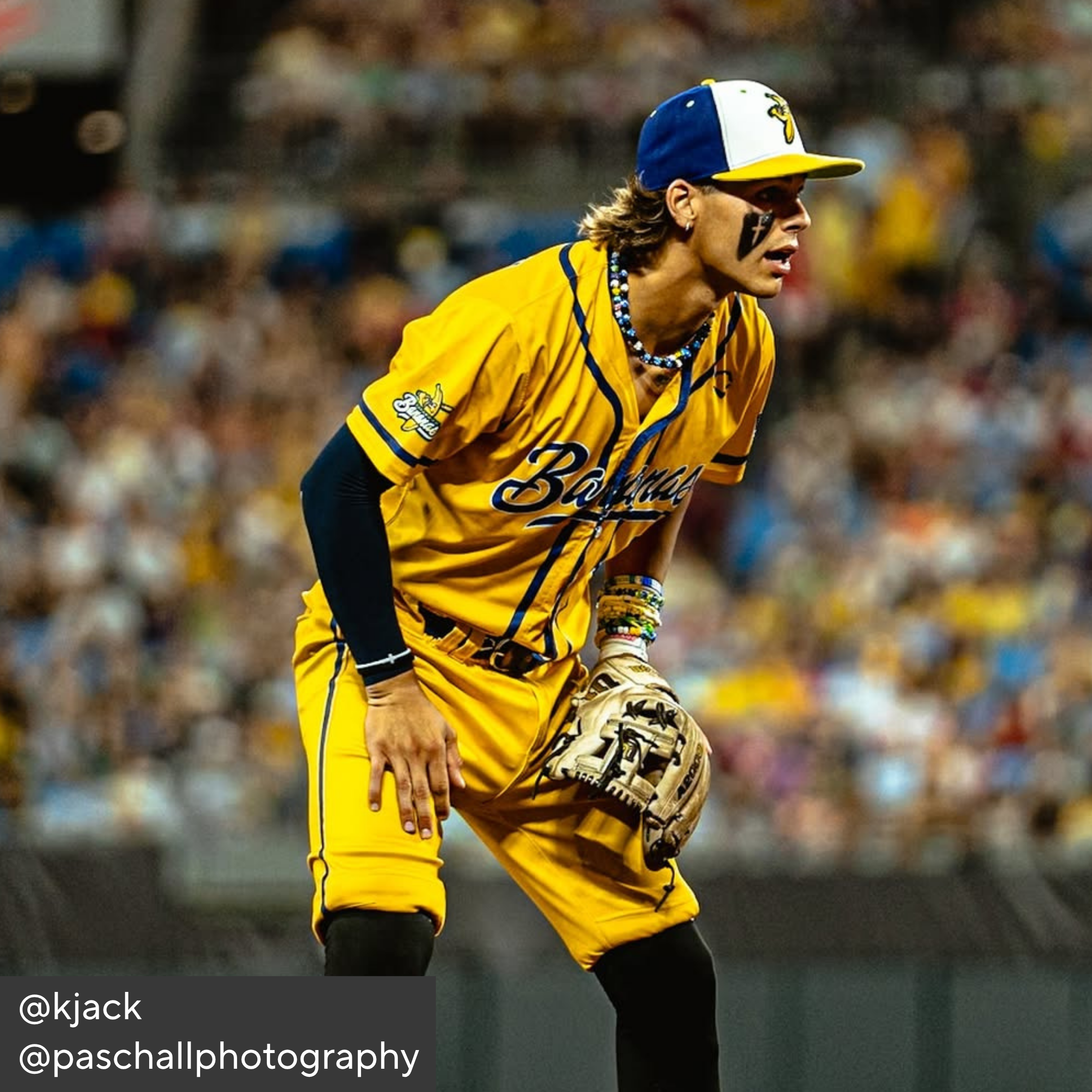 Baseball player in yellow uniform with &