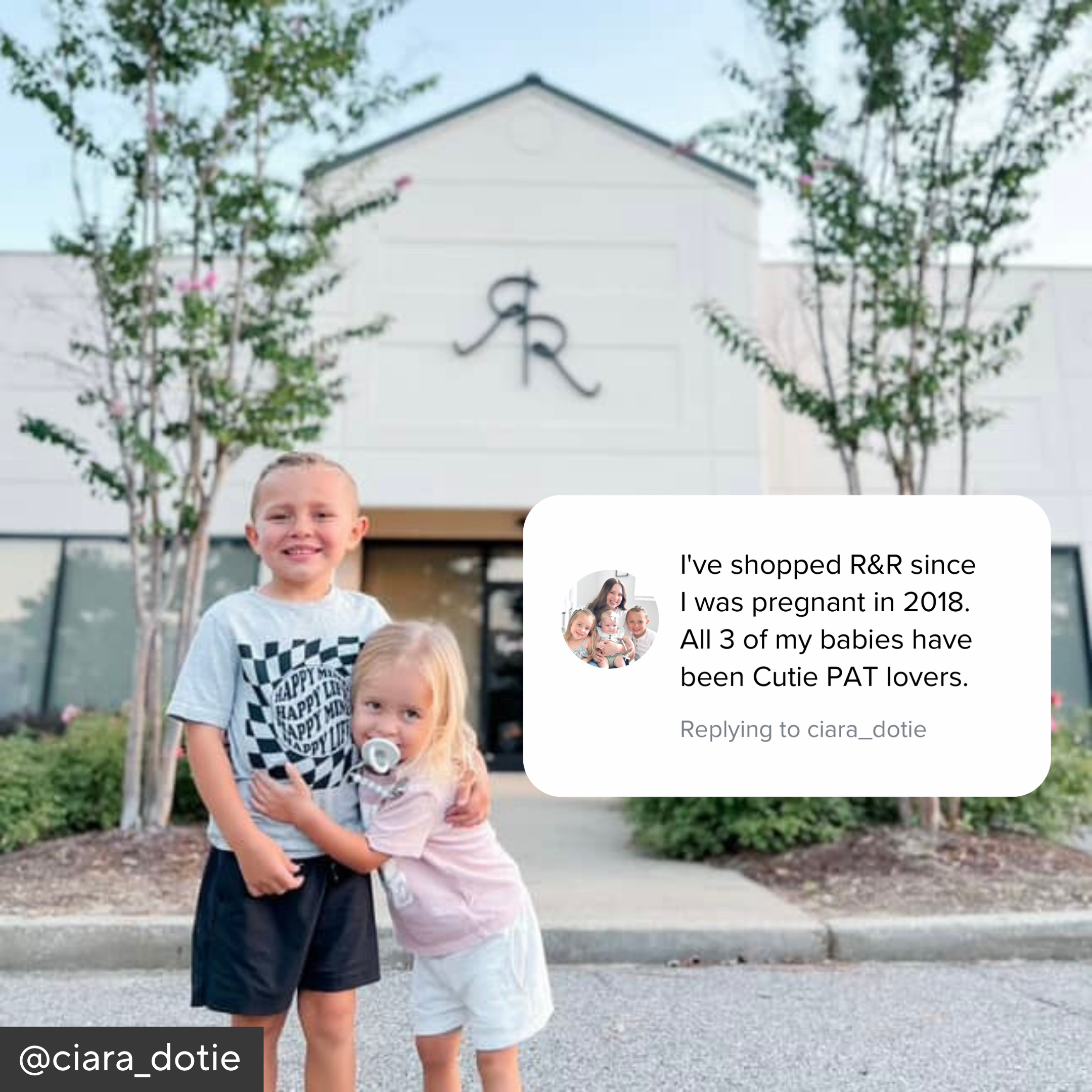 Two children standing in front of a store with a comment overlay.