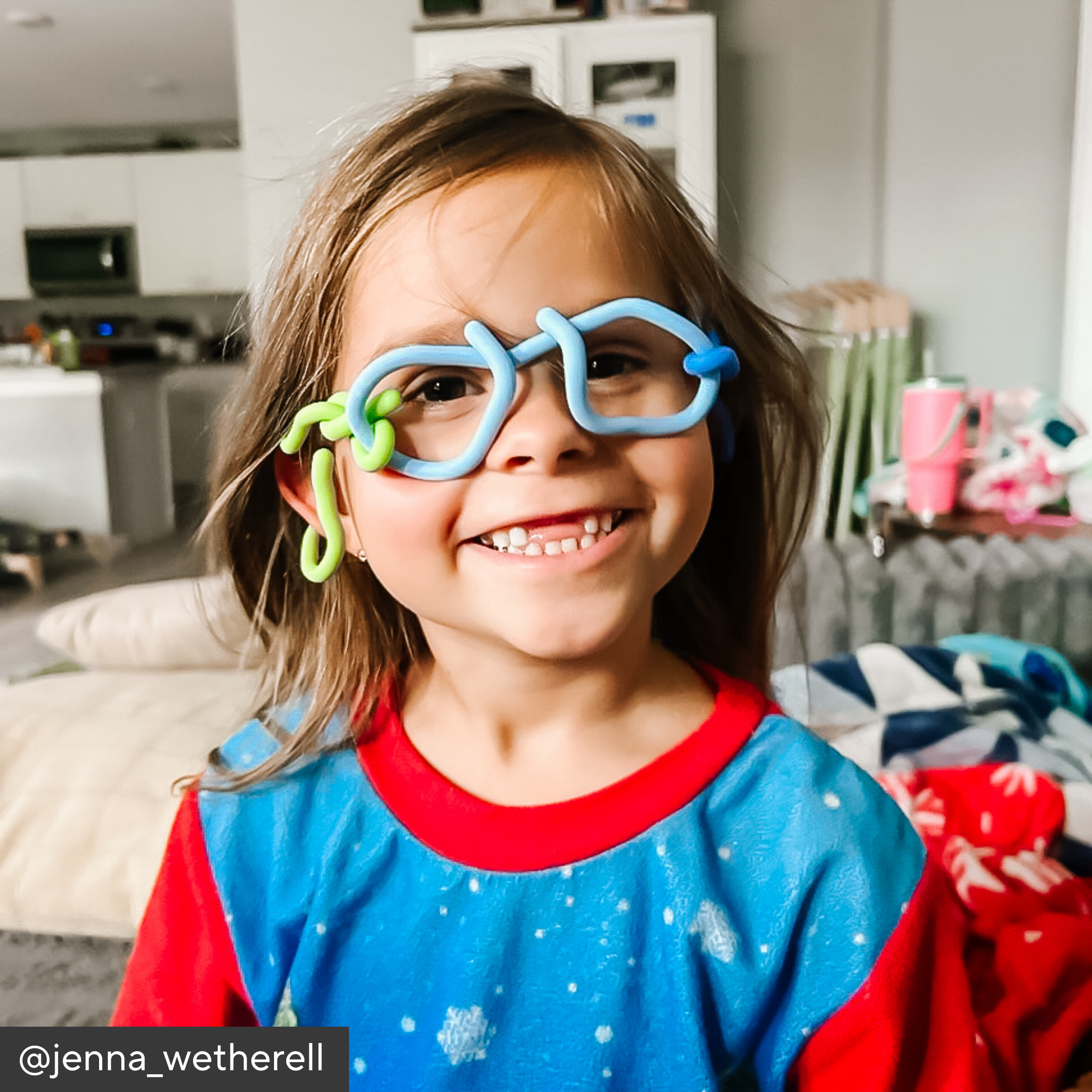 Kid playing with imagination sticks on his face shaped like glasses