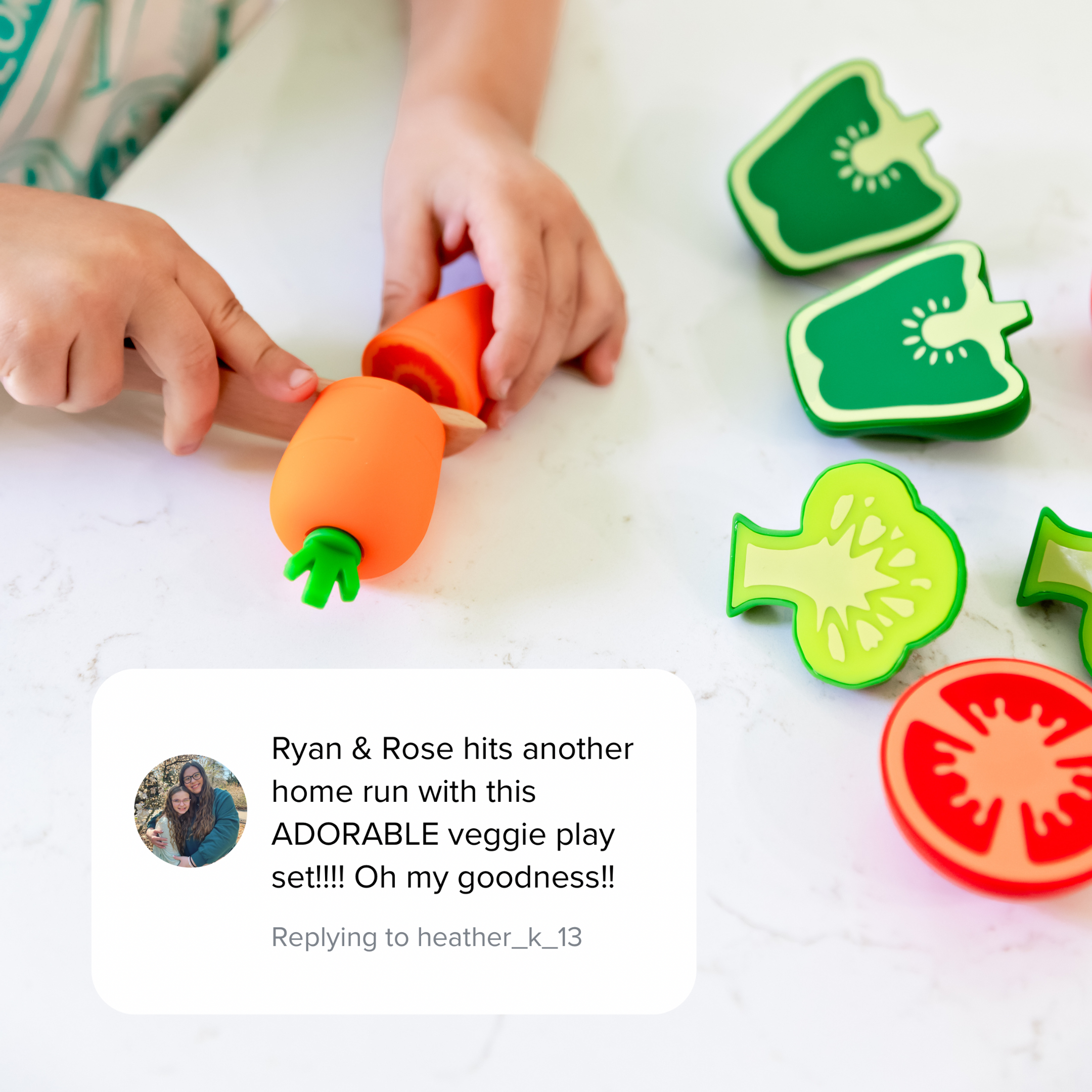 Children playing with a set of colorful vegetable-shaped play food on a white surface.