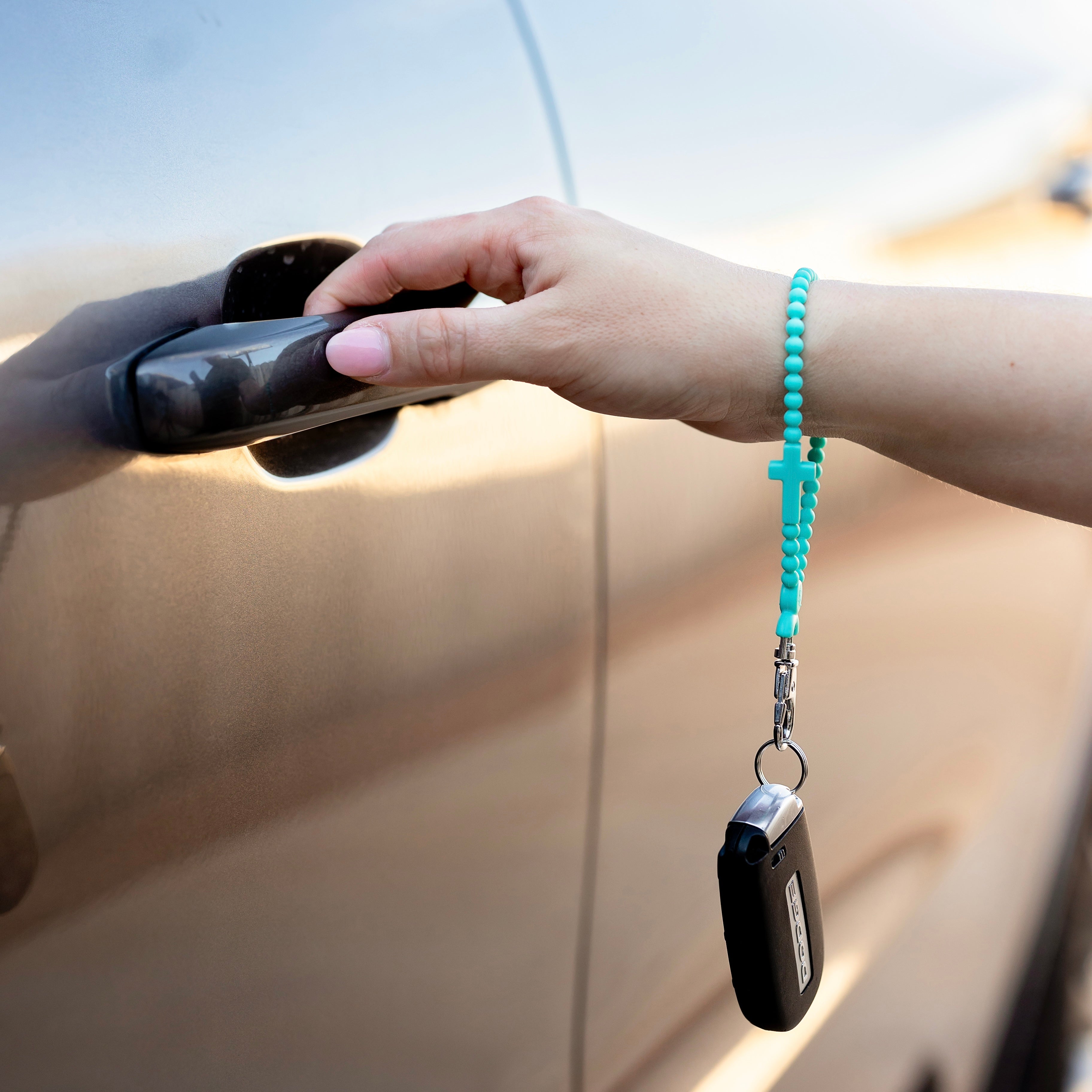 Woman opening car door.