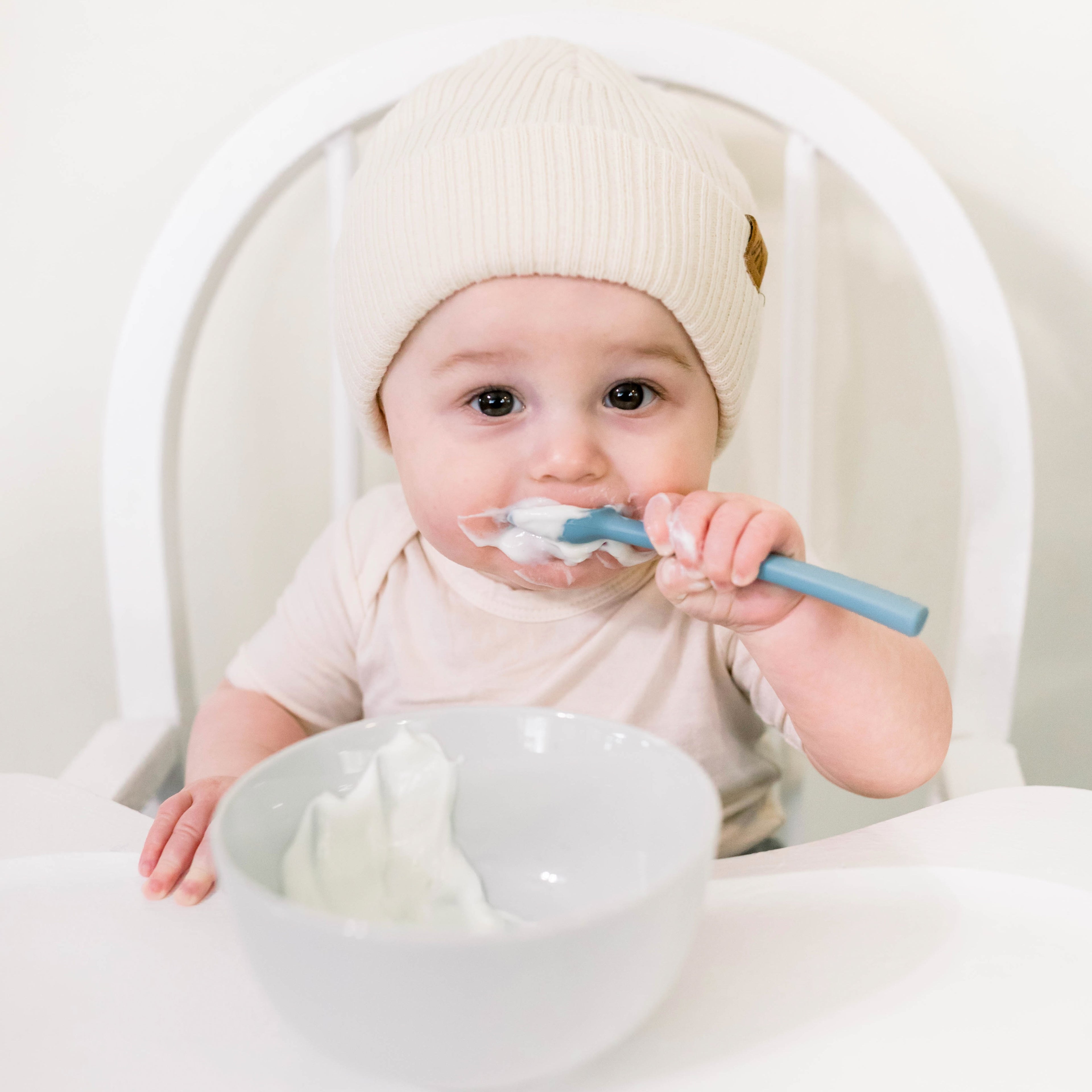 Baby eating with spoovel