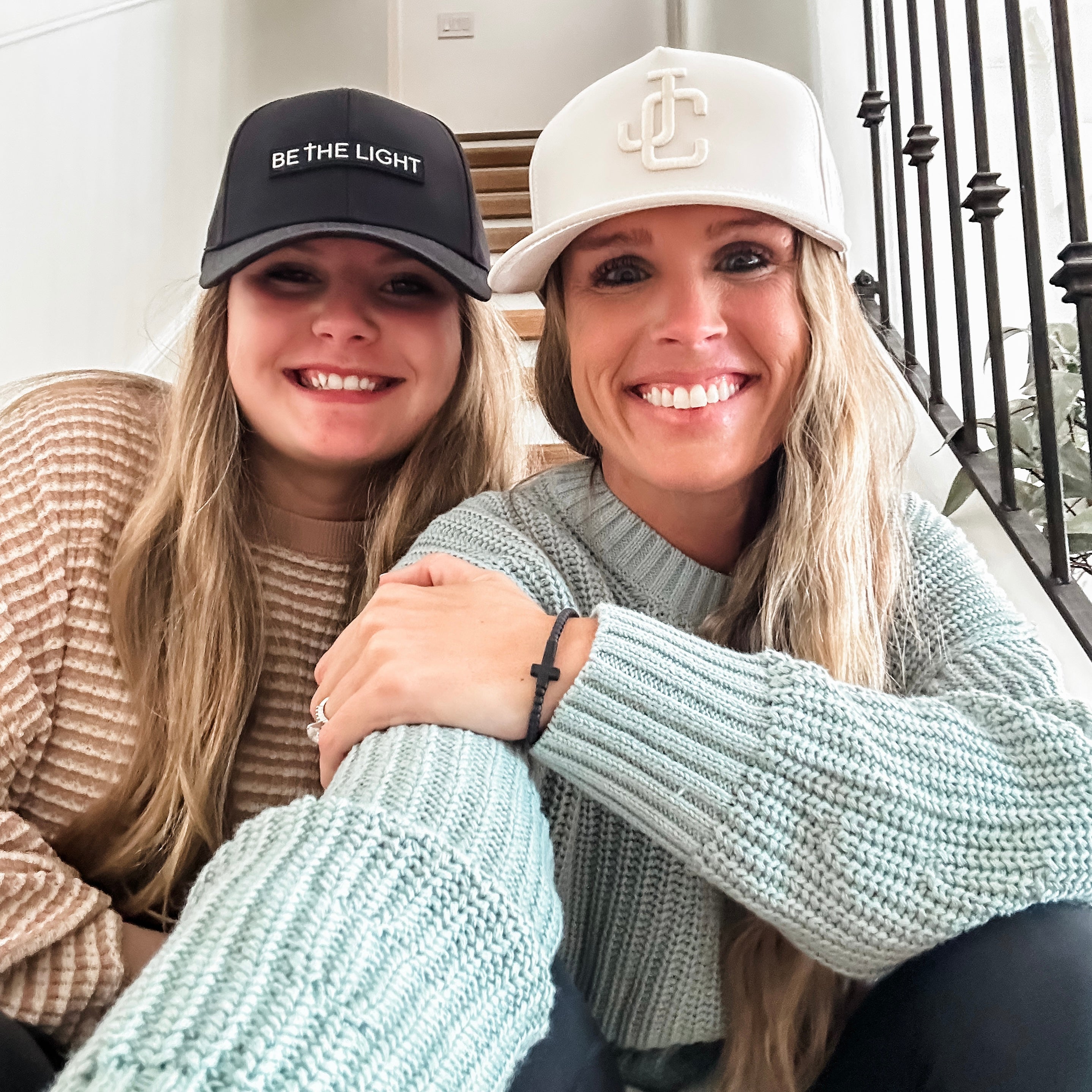 Women wearing Jesus Christ and Be The Light Hats