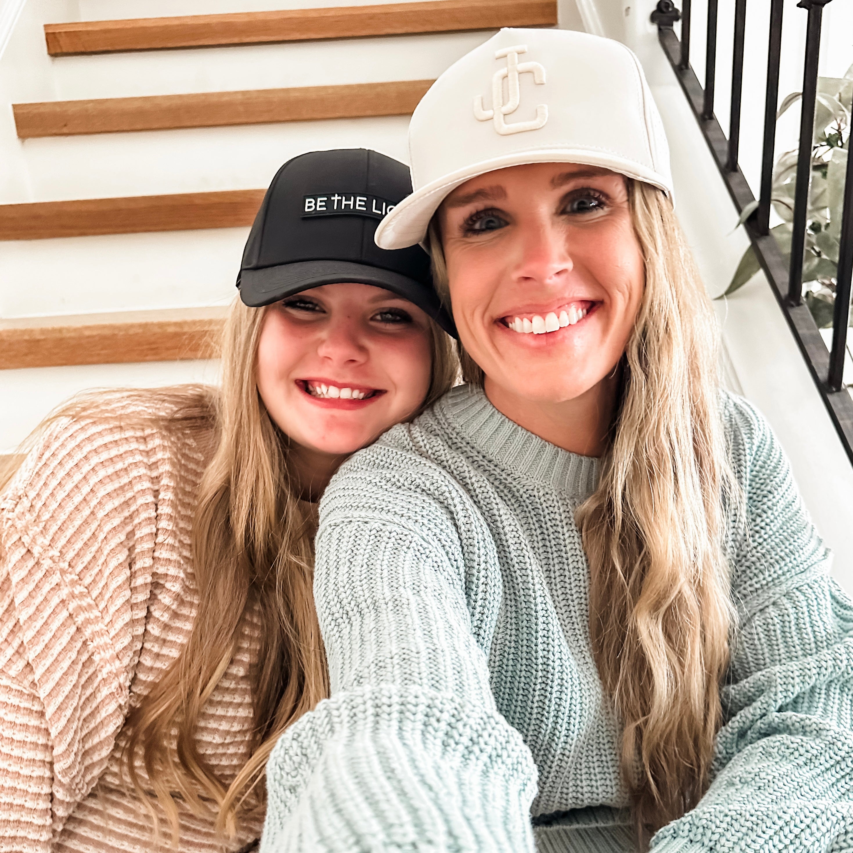 Women wearing Jesus Christ and Be The Light Hats