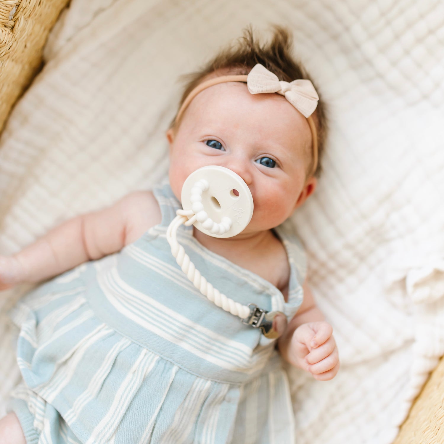 Baby with a pacifier and clip