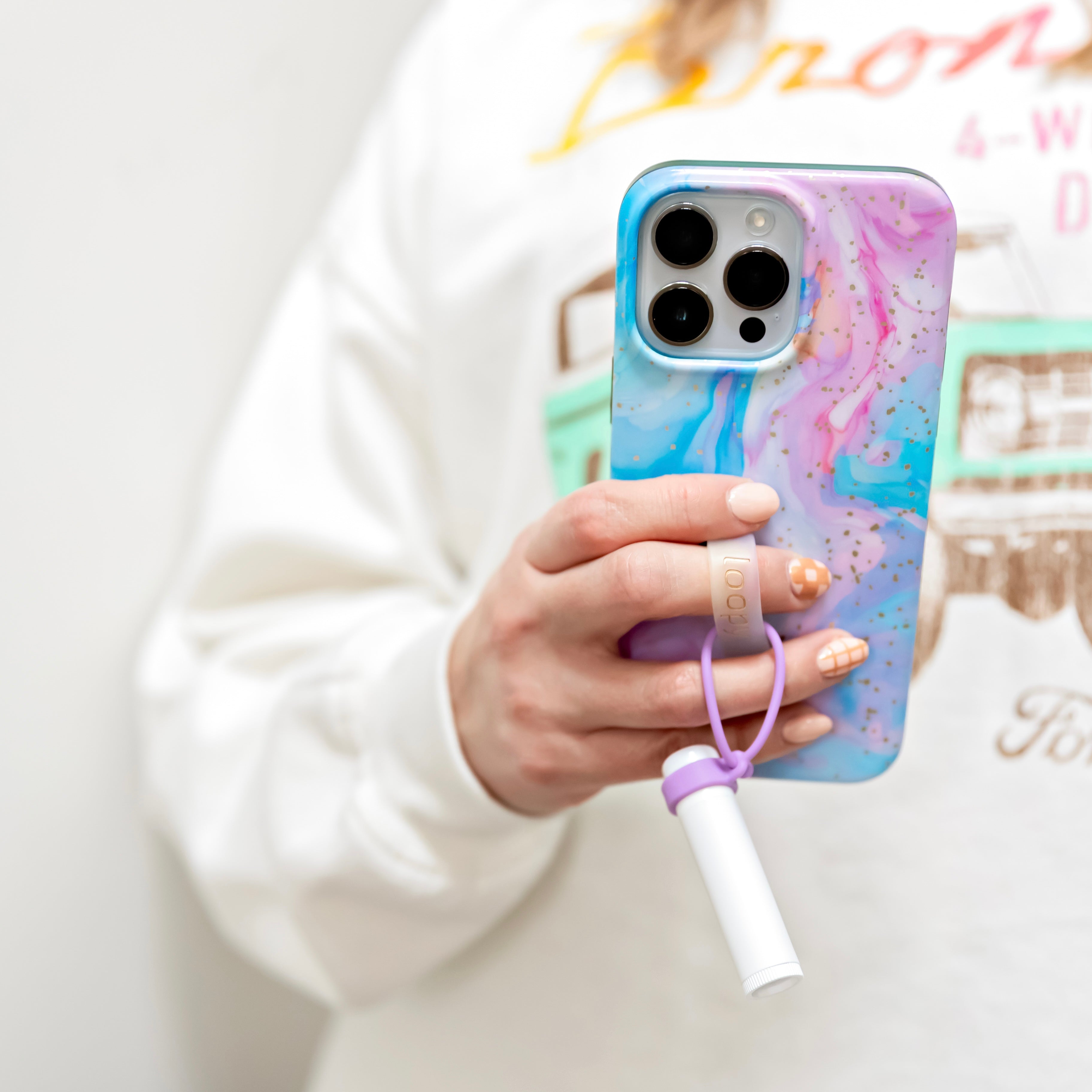 Lip balm holder attached to phone case