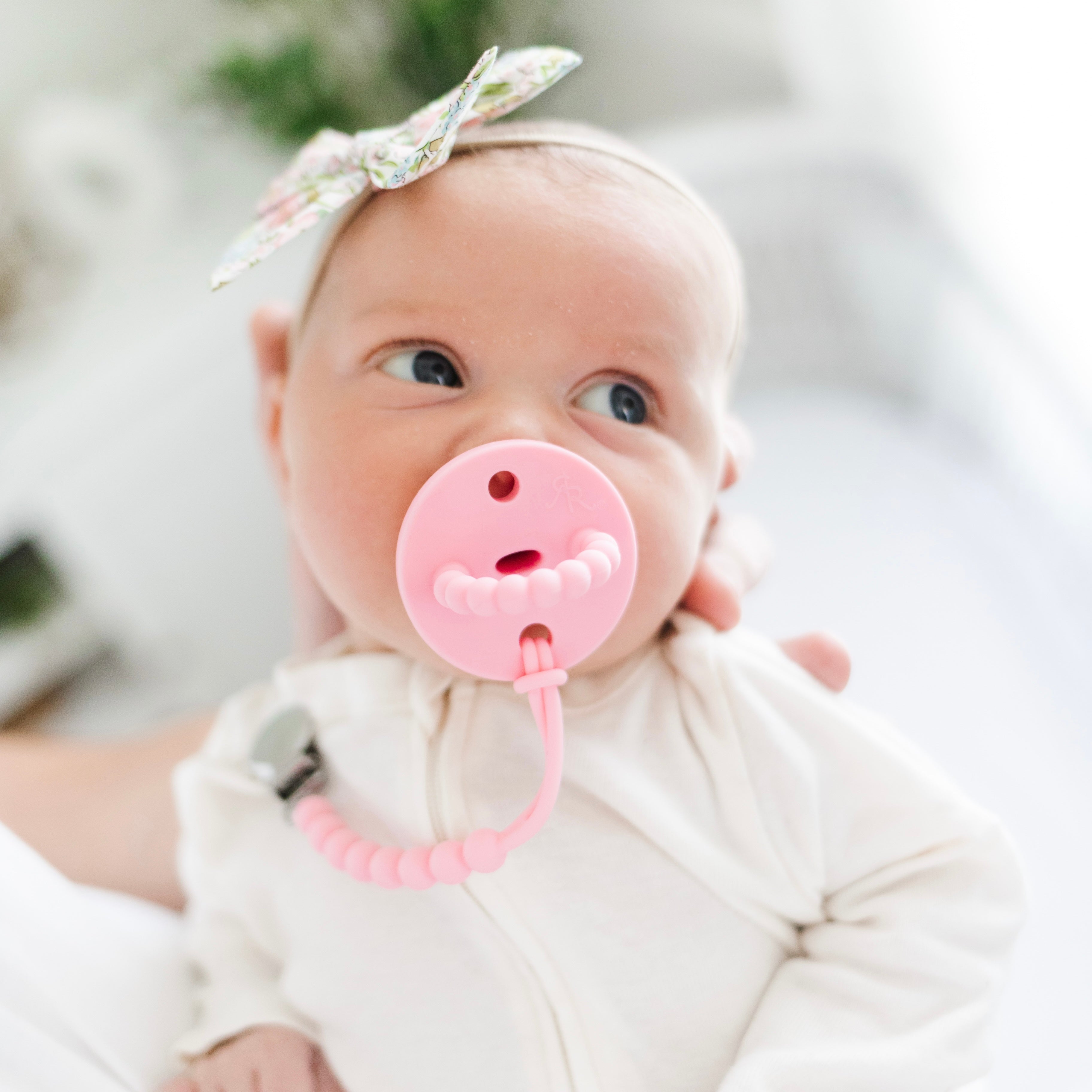 Baby with a pacifier and clip
