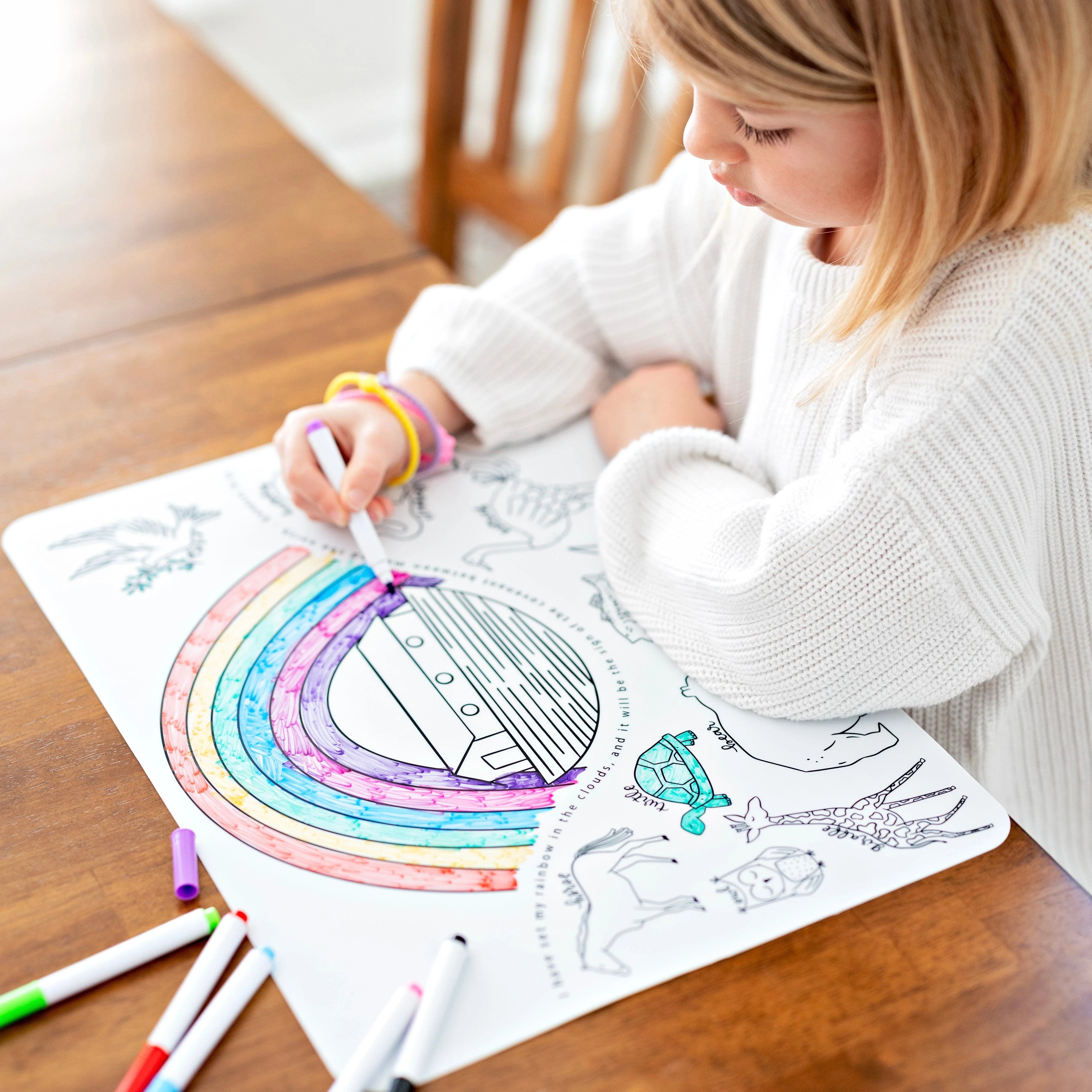 Girl coloring on silicone mats