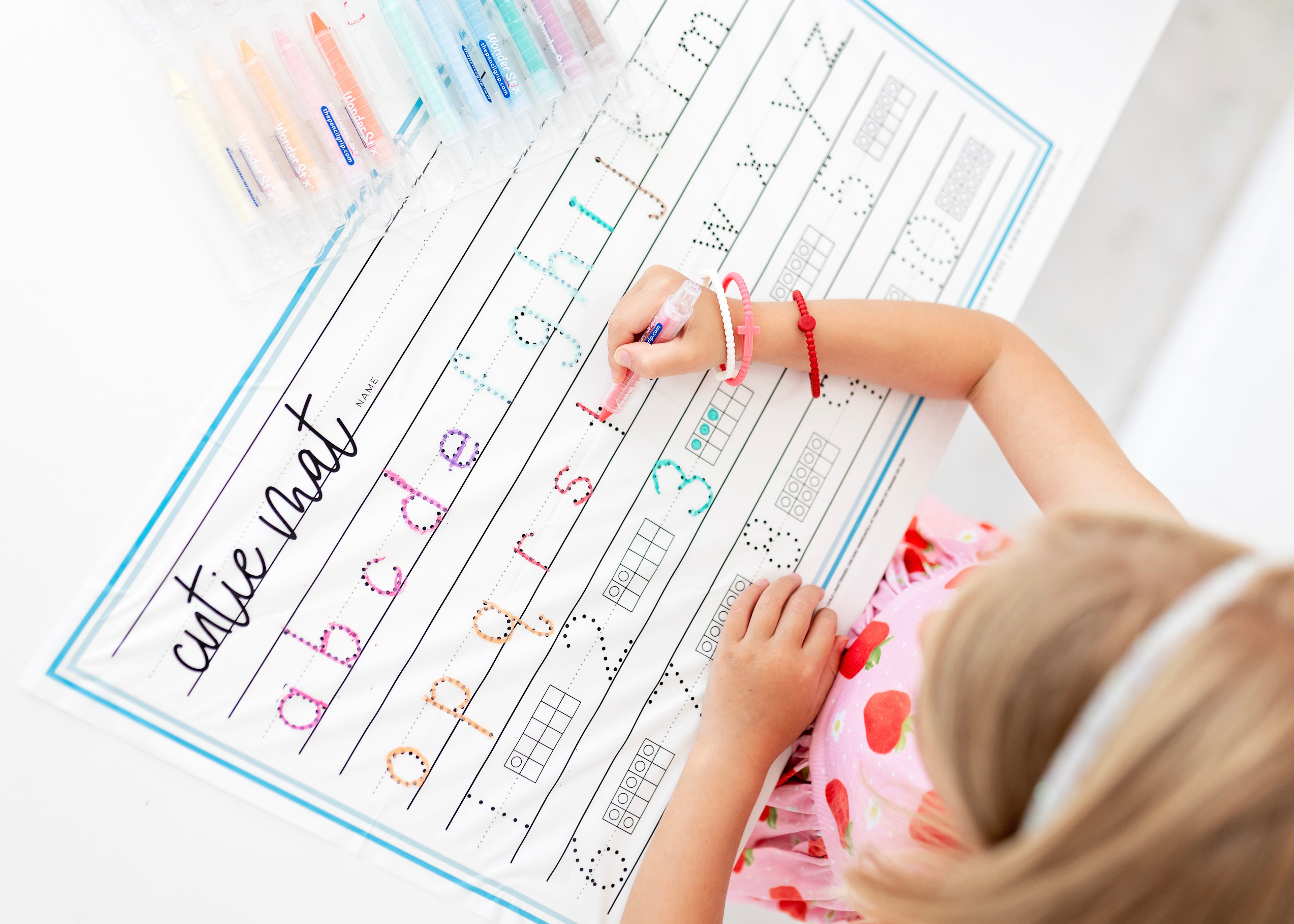 Girl tracing the Cutie Mat