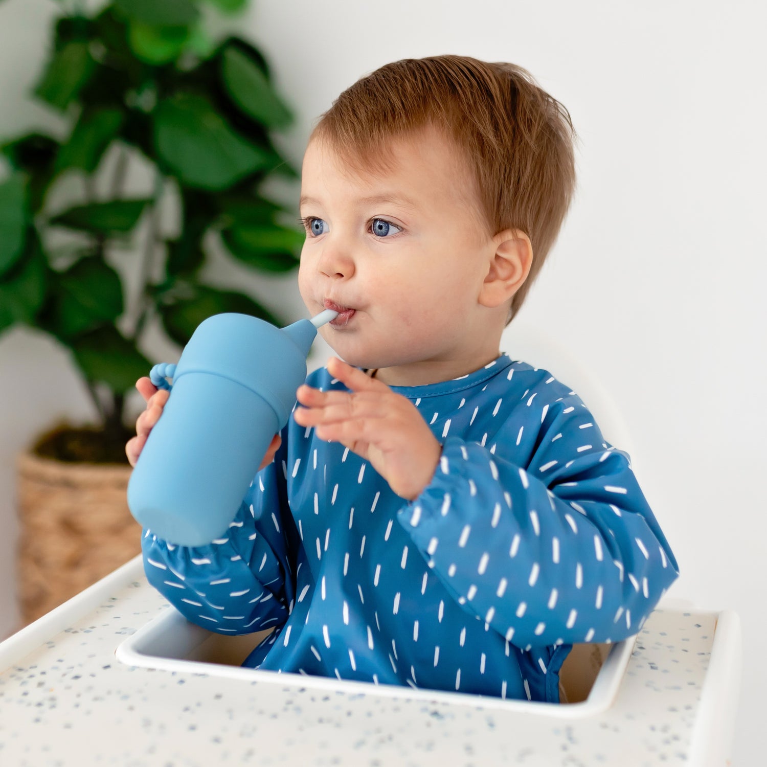 Baby drinking out of a sippy cup