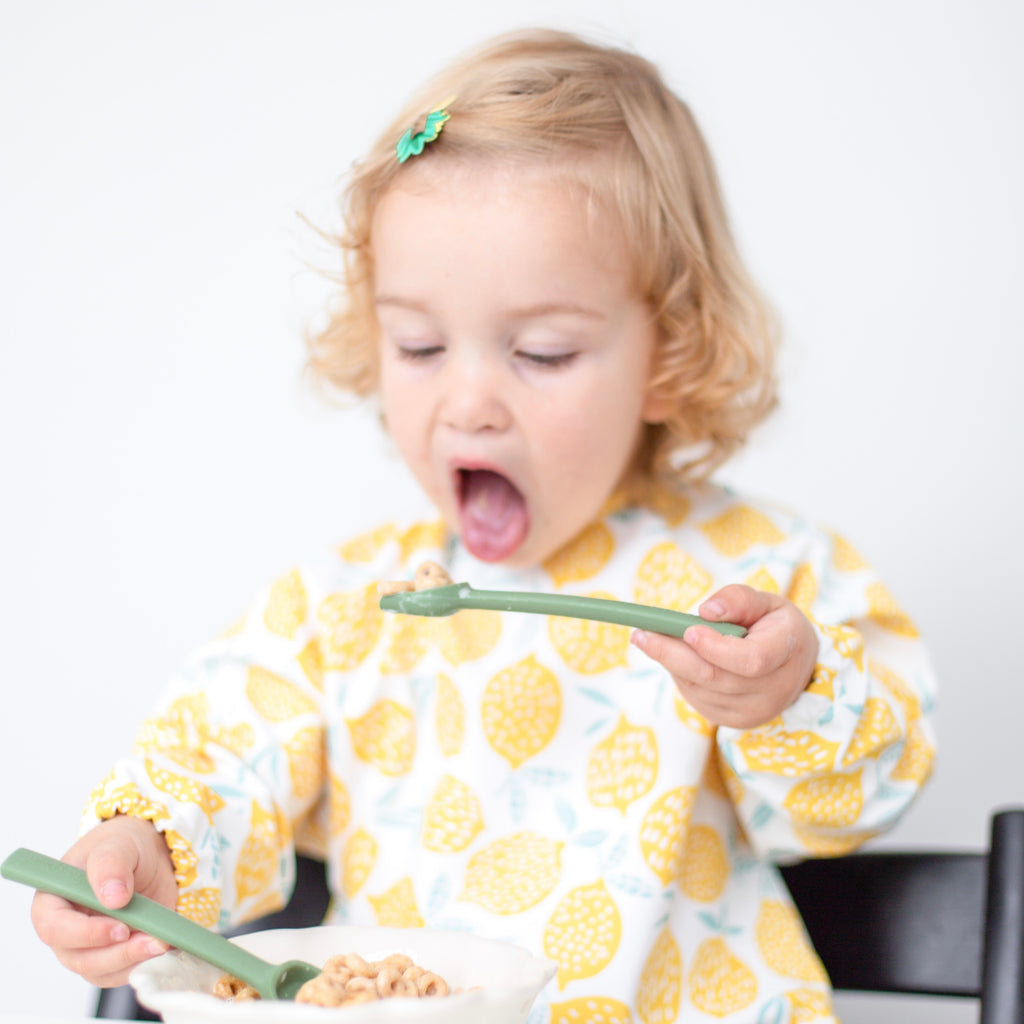 Toddler eating cereal with the Cutie Spoovel.