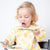 Toddler eating cereal with the Cutie Spoovel.