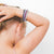 Girl putting Cutie Bangles in her hair.